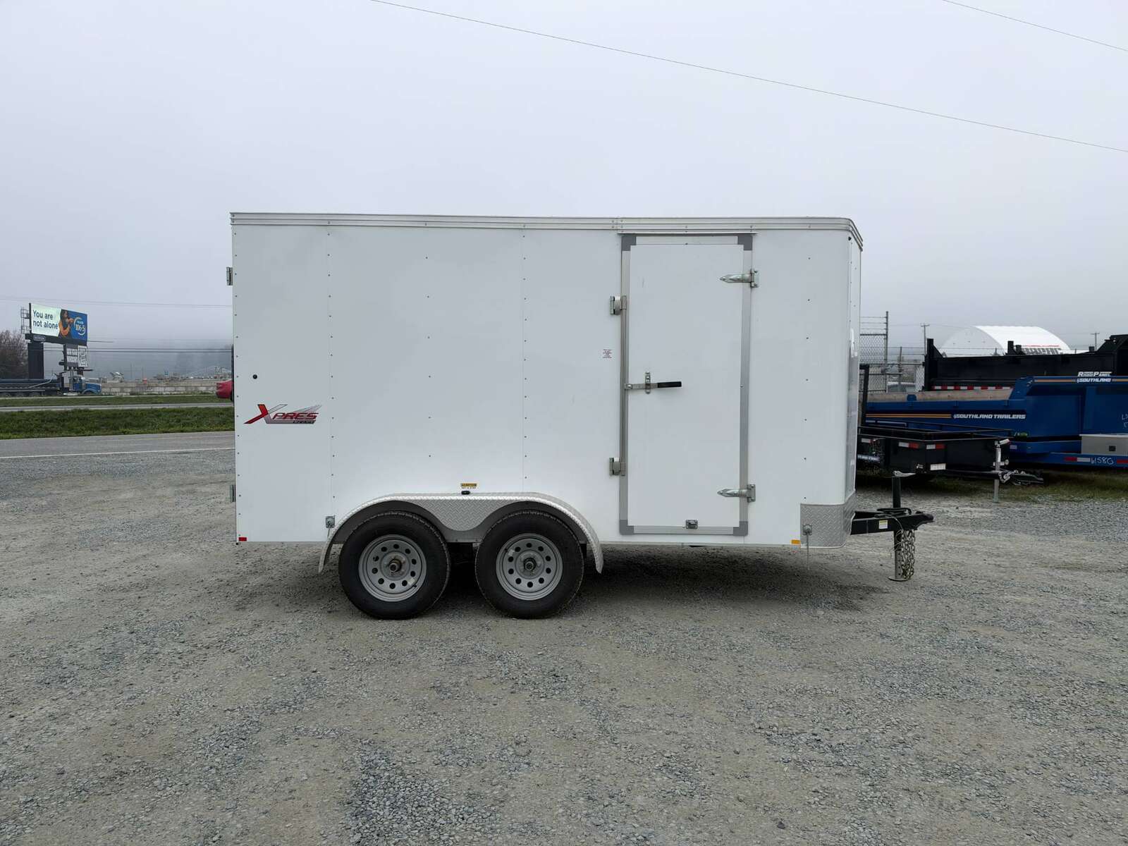 Photo of Pre Owned Used 2021 Mirage Cargo Enclosed V Nose Trailer 6x12 White w/ Barn Doors 7000lb GVW