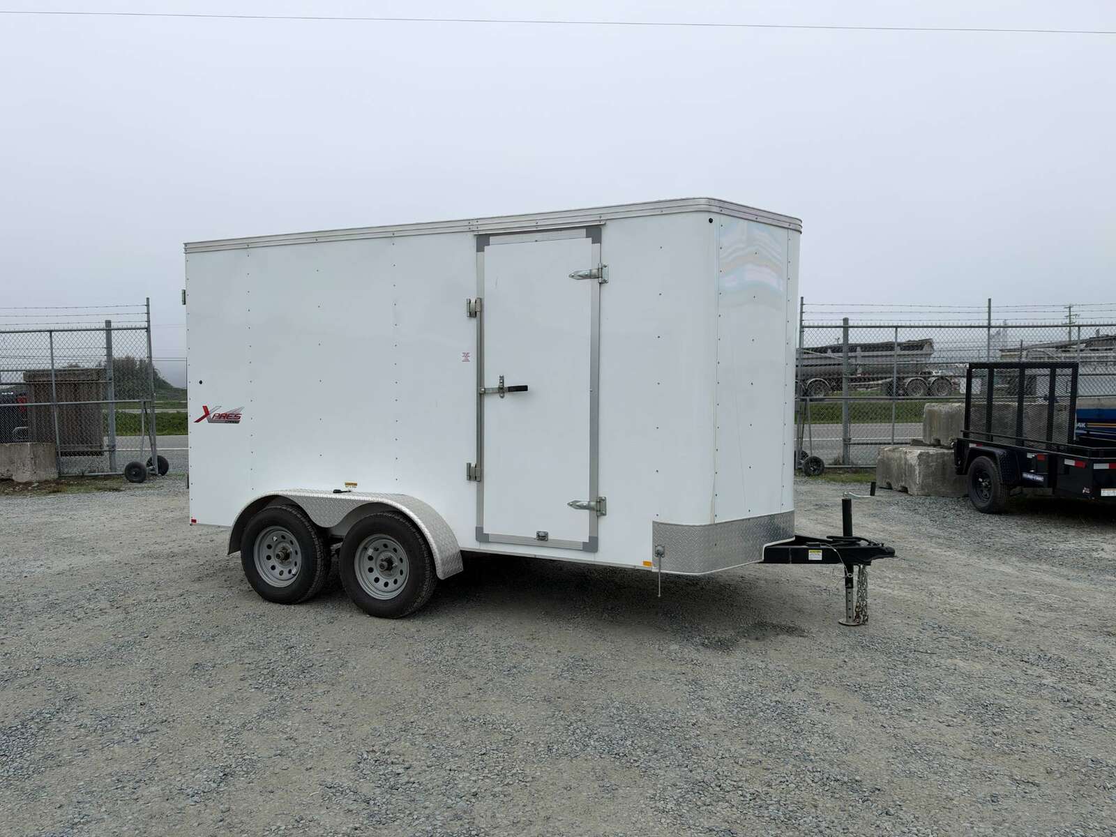 Photo of Pre Owned Used 2021 Mirage Cargo Enclosed V Nose Trailer 6x12 White w/ Barn Doors 7000lb GVW