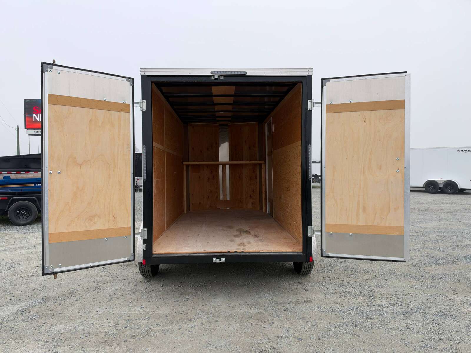 Photo of Pre Owned Used 2021 Mirage Cargo Enclosed V Nose Trailer 6x12 White w/ Barn Doors 7000lb GVW