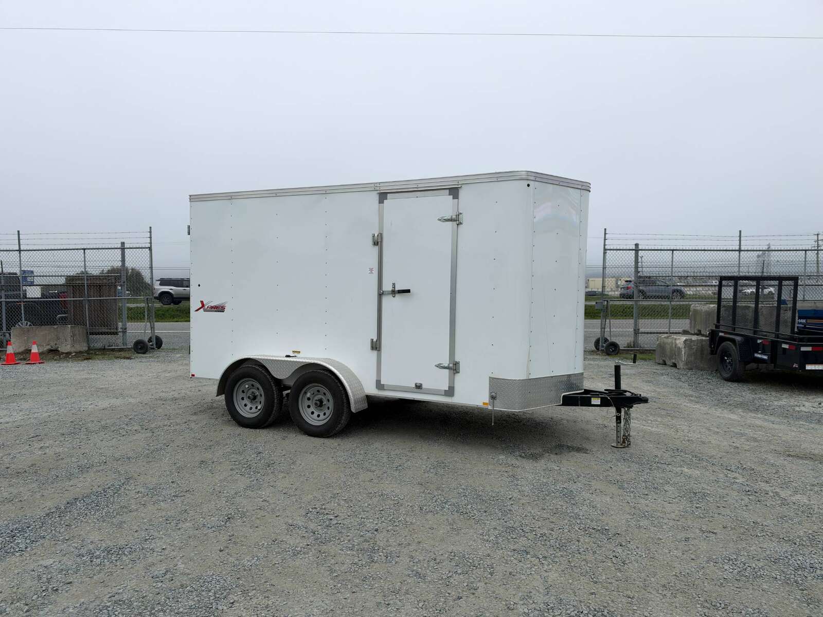 Photo of Pre Owned Used 2021 Mirage Cargo Enclosed V Nose Trailer 6x12 White w/ Barn Doors 7000lb GVW