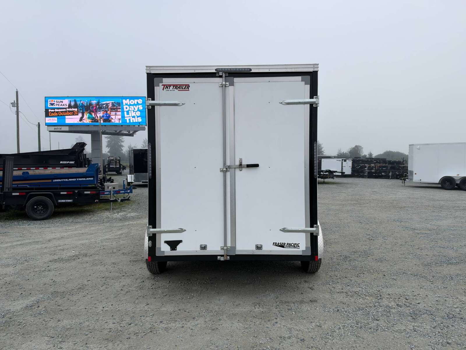 Photo of Pre Owned Used 2021 Mirage Cargo Enclosed V Nose Trailer 6x12 White w/ Barn Doors 7000lb GVW