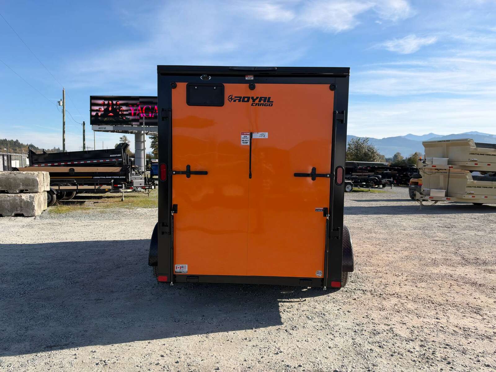Photo of 2027 Royal Cargo 6x12 V Nose Cargo / Enclosed Trailer Orange Ramp Door w/ Blackout Package Tandem Axle 7700lb GVW (GSR)