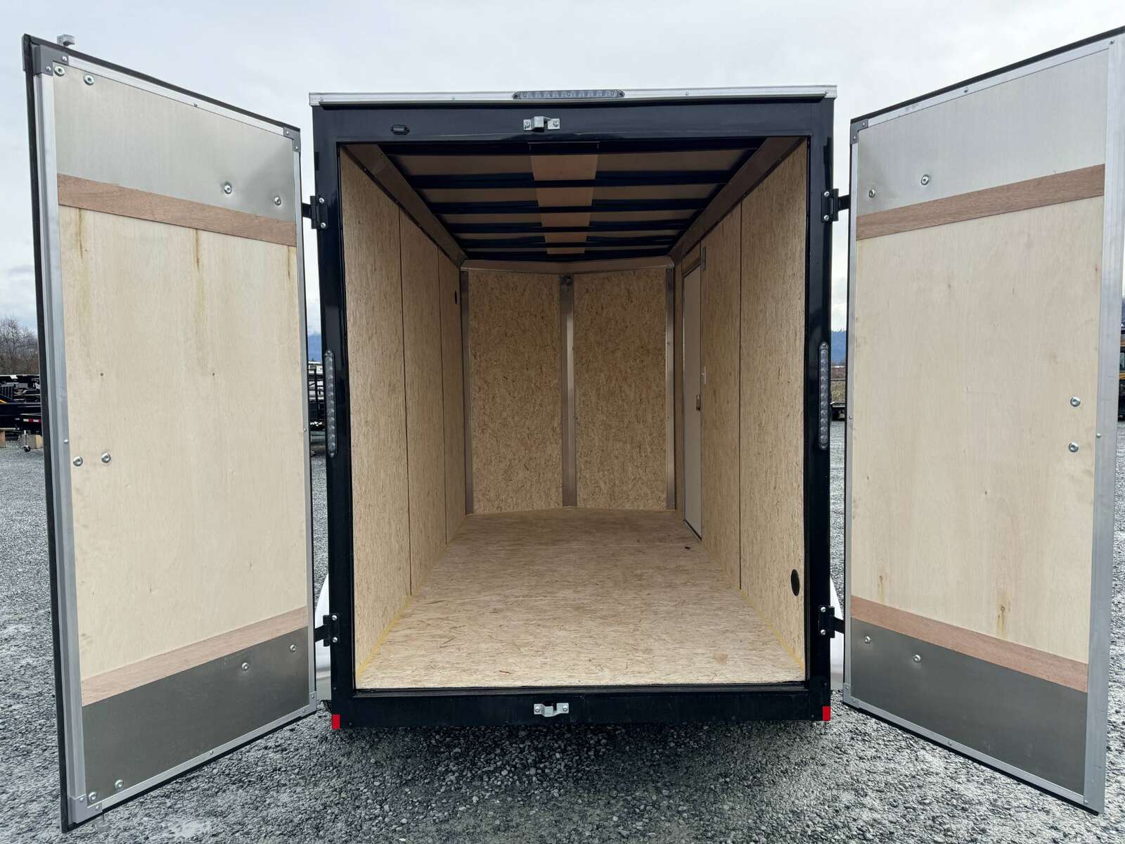 Photo of 2024 Mirage XE 6x12 V Nose Tandem Axle Cargo / Enclosed Trailer Black Barn Doors Extra Height 7,000lb GVW