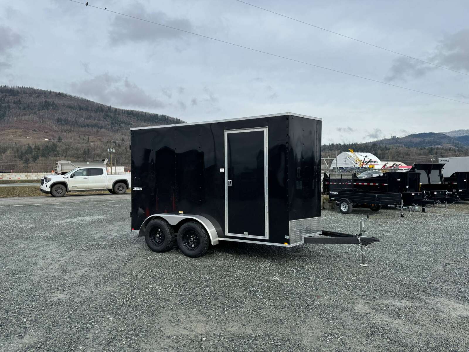 Photo of 2024 Mirage XE 6x12 V Nose Tandem Axle Cargo / Enclosed Trailer Black Barn Doors Extra Height 7,000lb GVW