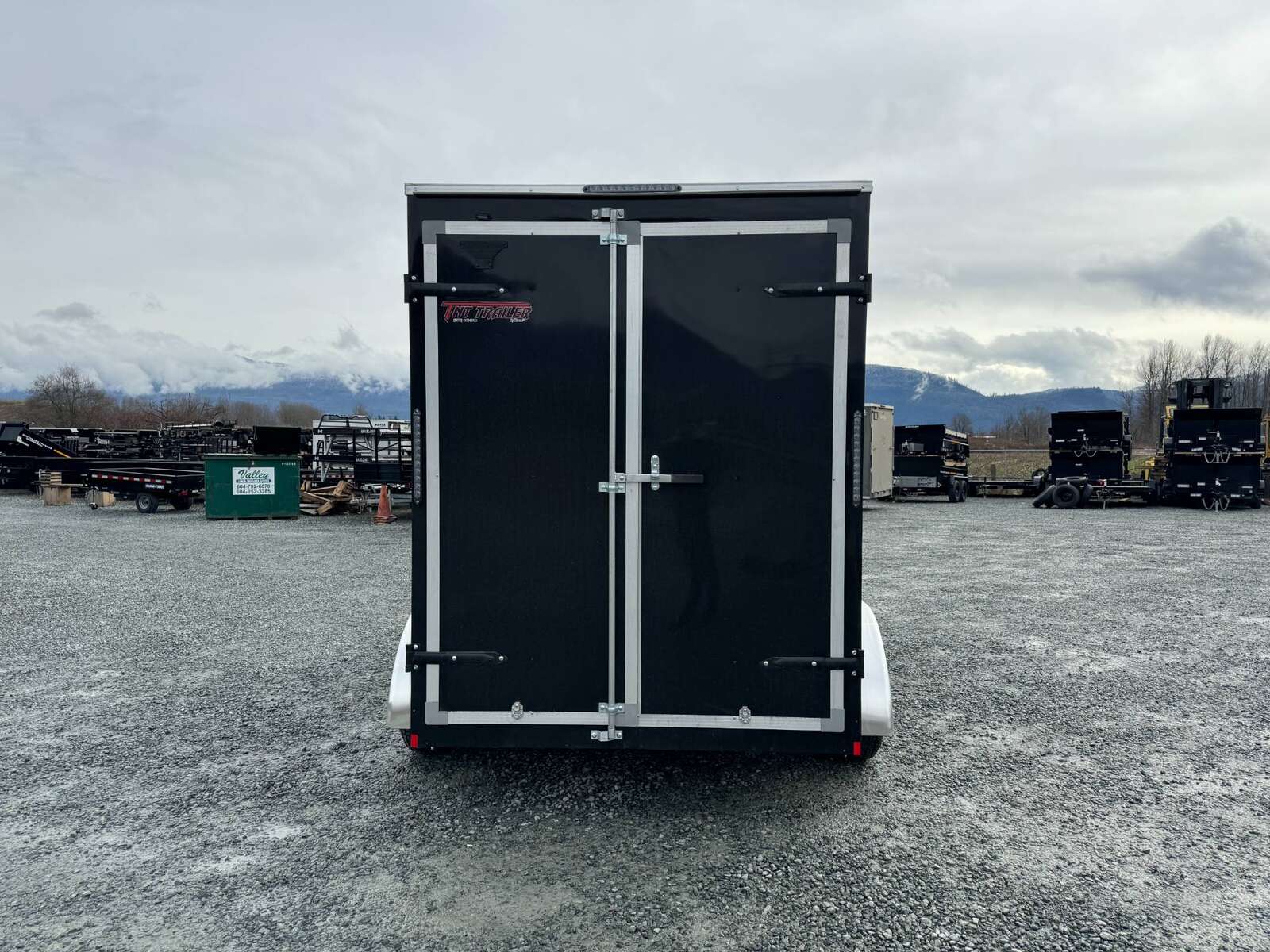 Photo of 2024 Mirage XE 6x12 V Nose Tandem Axle Cargo / Enclosed Trailer Black Barn Doors Extra Height 7,000lb GVW