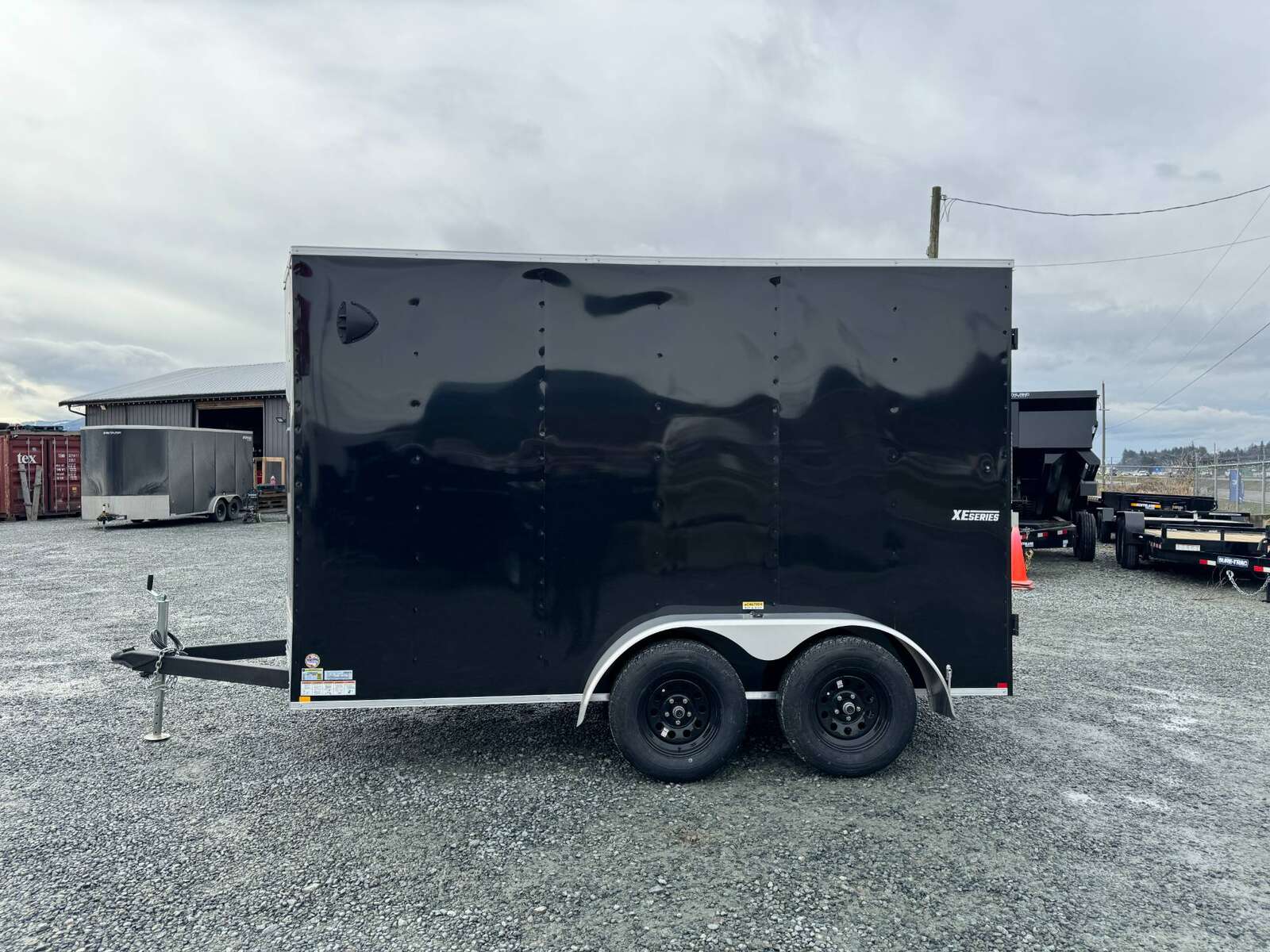 Photo of 2024 Mirage XE 6x12 V Nose Tandem Axle Cargo / Enclosed Trailer Black Barn Doors Extra Height 7,000lb GVW