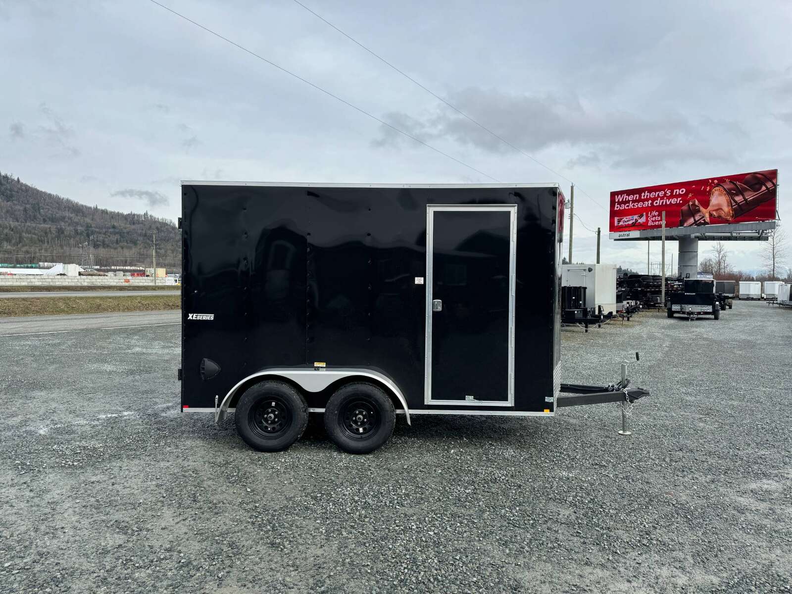 Photo of 2024 Mirage XE 6x12 V Nose Tandem Axle Cargo / Enclosed Trailer Black Barn Doors Extra Height 7,000lb GVW