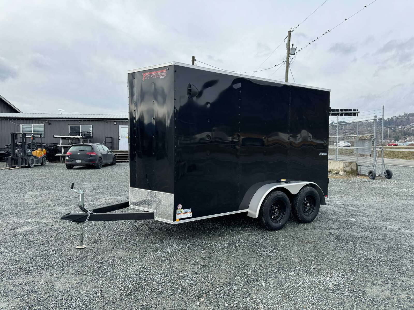 Photo of 2024 Mirage XE 6x12 V Nose Tandem Axle Cargo / Enclosed Trailer Black Barn Doors Extra Height 7,000lb GVW