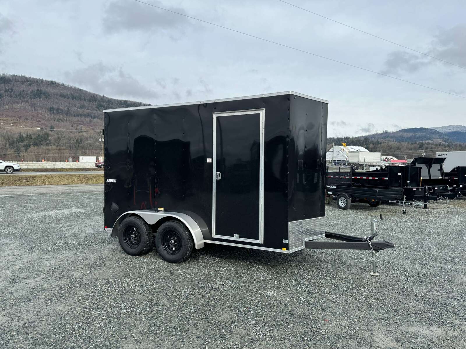 Photo of 2024 Mirage XE 6x12 V Nose Tandem Axle Cargo / Enclosed Trailer Black Barn Doors Extra Height 7,000lb GVW