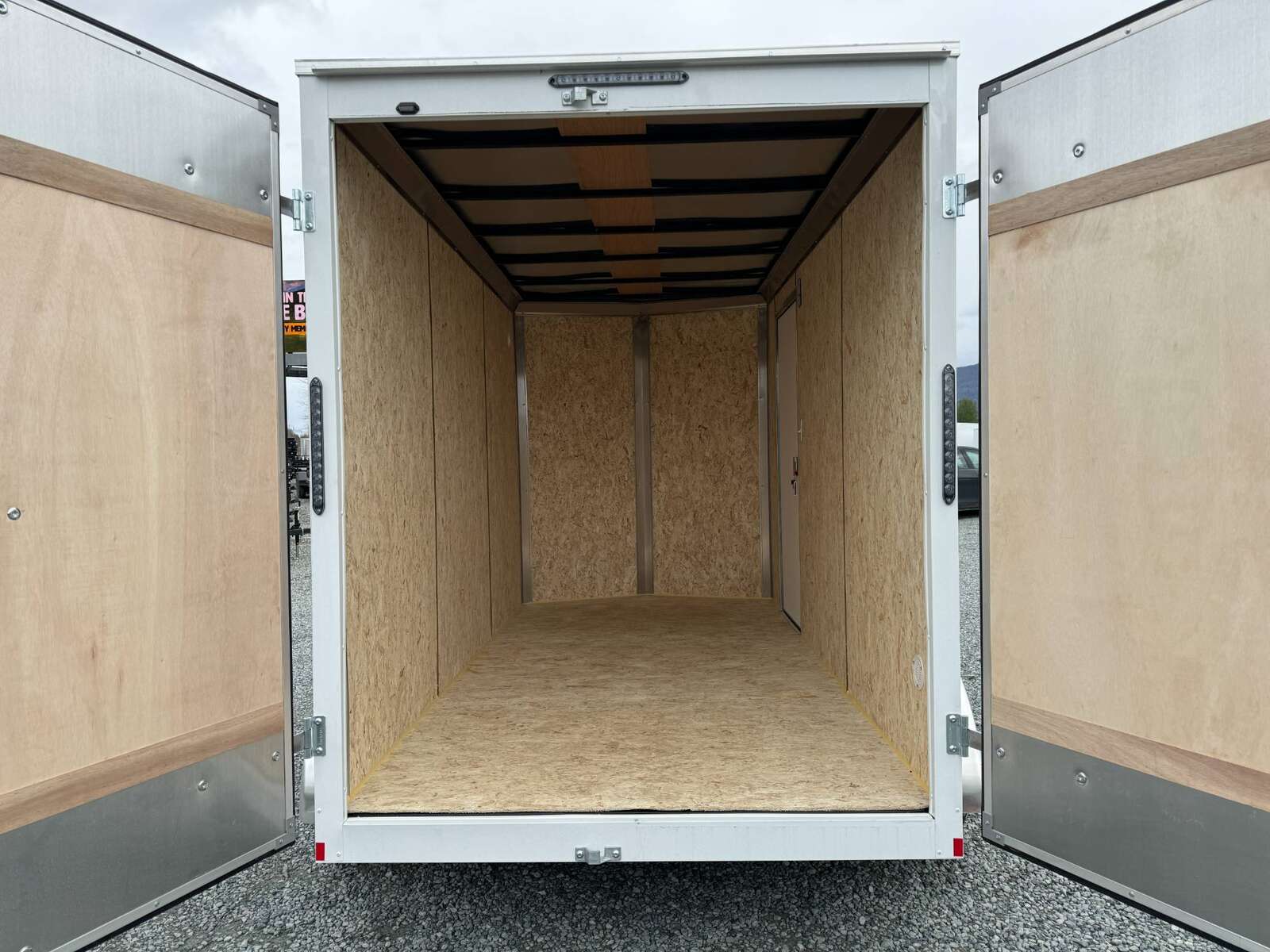 Photo of 2025 Mirage XE 6x12 V Nose Tandem Axle Cargo / Enclosed Trailer White Barn Doors Extra Height 7,000lb GVW