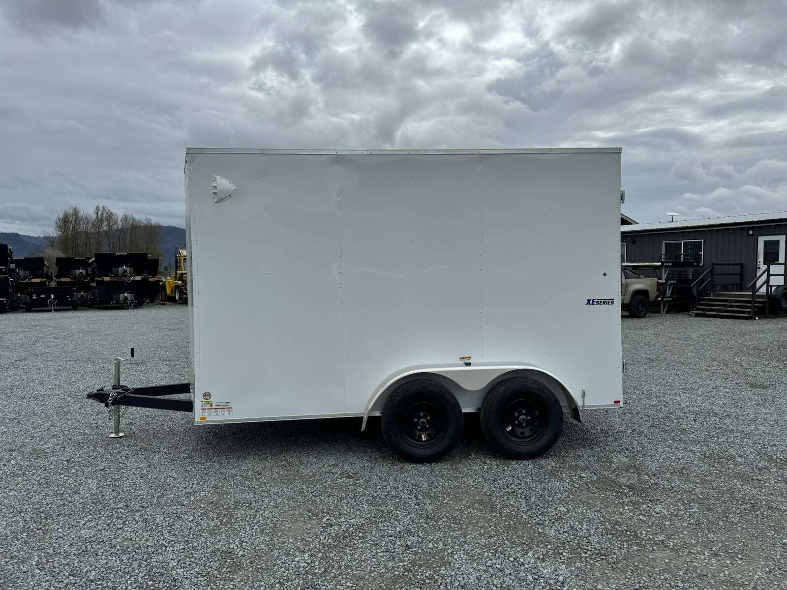 Photo of 2025 Mirage XE 6x12 V Nose Tandem Axle Cargo / Enclosed Trailer White Barn Doors Extra Height 7,000lb GVW