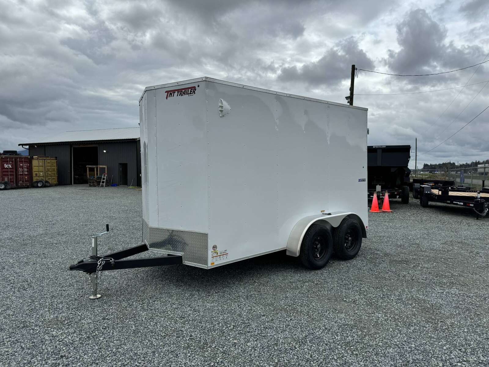 Photo of 2025 Mirage XE 6x12 V Nose Tandem Axle Cargo / Enclosed Trailer White Barn Doors Extra Height 7,000lb GVW