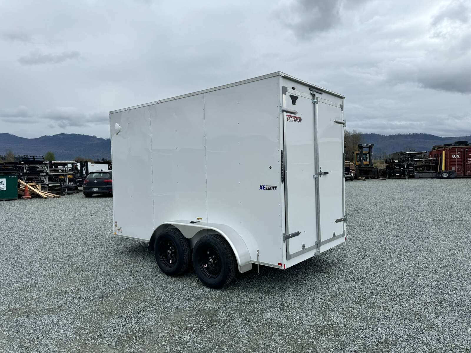 Photo of 2025 Mirage XE 6x12 V Nose Tandem Axle Cargo / Enclosed Trailer White Barn Doors Extra Height 7,000lb GVW