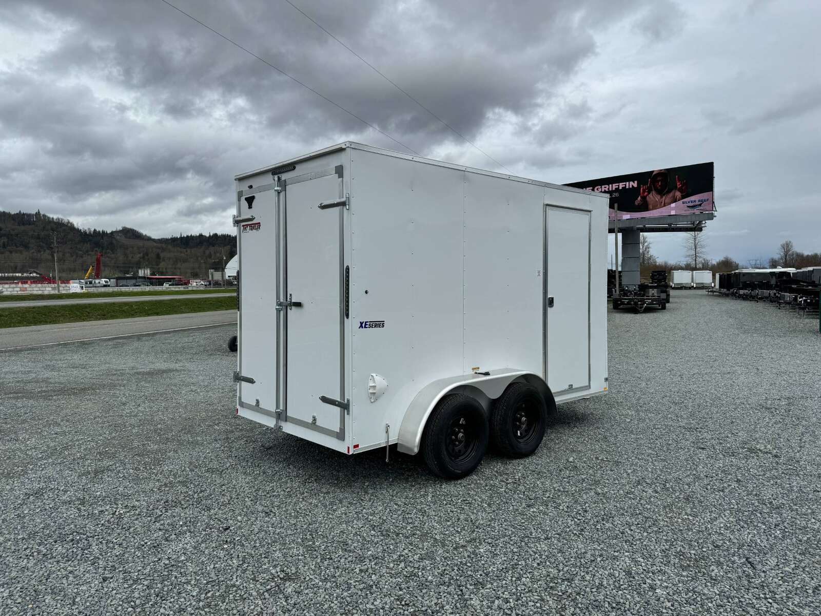 Photo of 2025 Mirage XE 6x12 V Nose Tandem Axle Cargo / Enclosed Trailer White Barn Doors Extra Height 7,000lb GVW