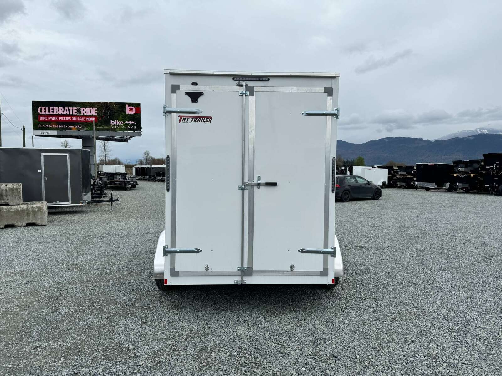 Photo of 2025 Mirage XE 6x12 V Nose Tandem Axle Cargo / Enclosed Trailer White Barn Doors Extra Height 7,000lb GVW