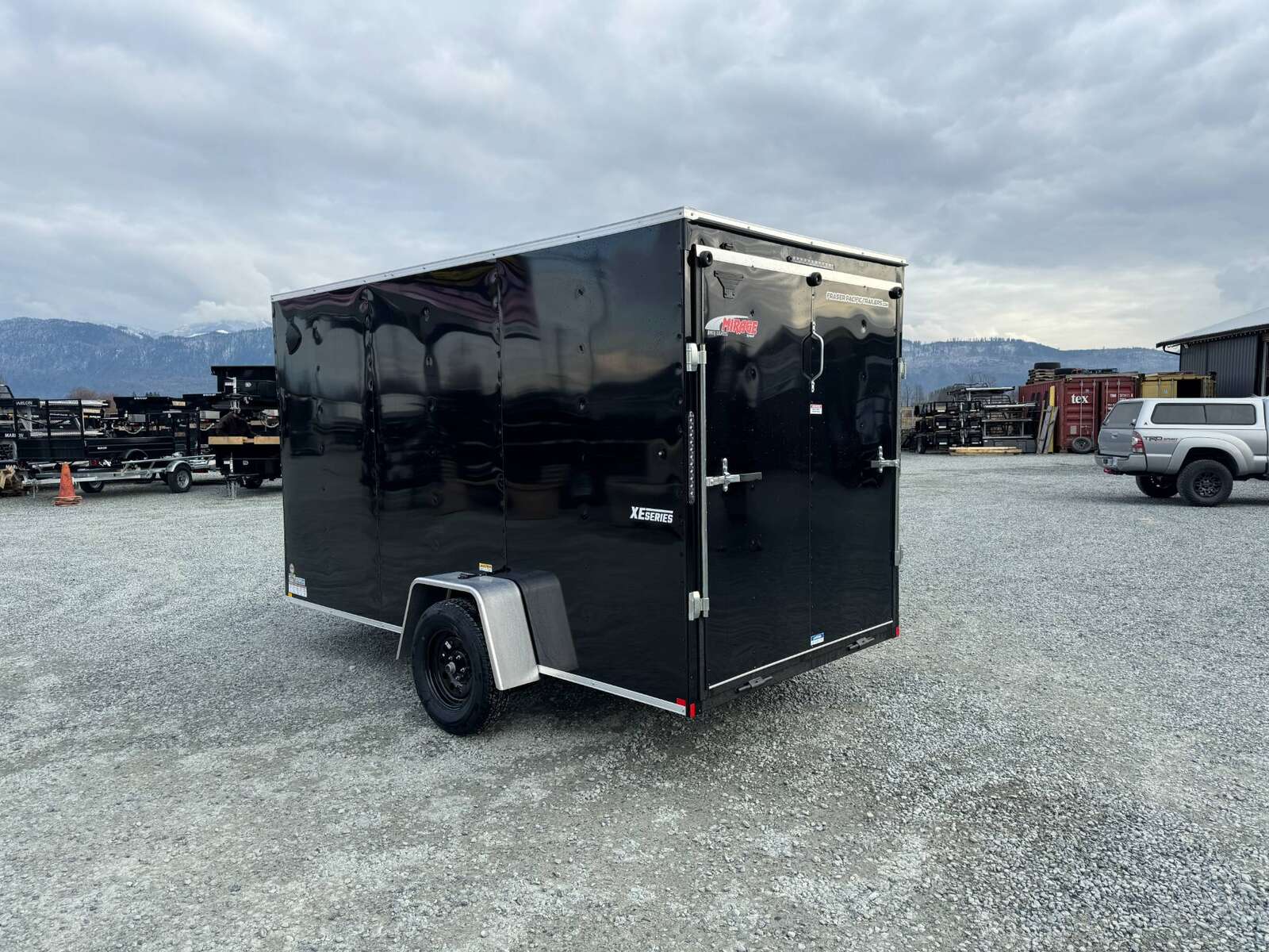 Photo of 2025 Mirage XE 6x12 V Nose Cargo / Enclosed Trailer Black Ramp Door Extra Height 2990lb GVW