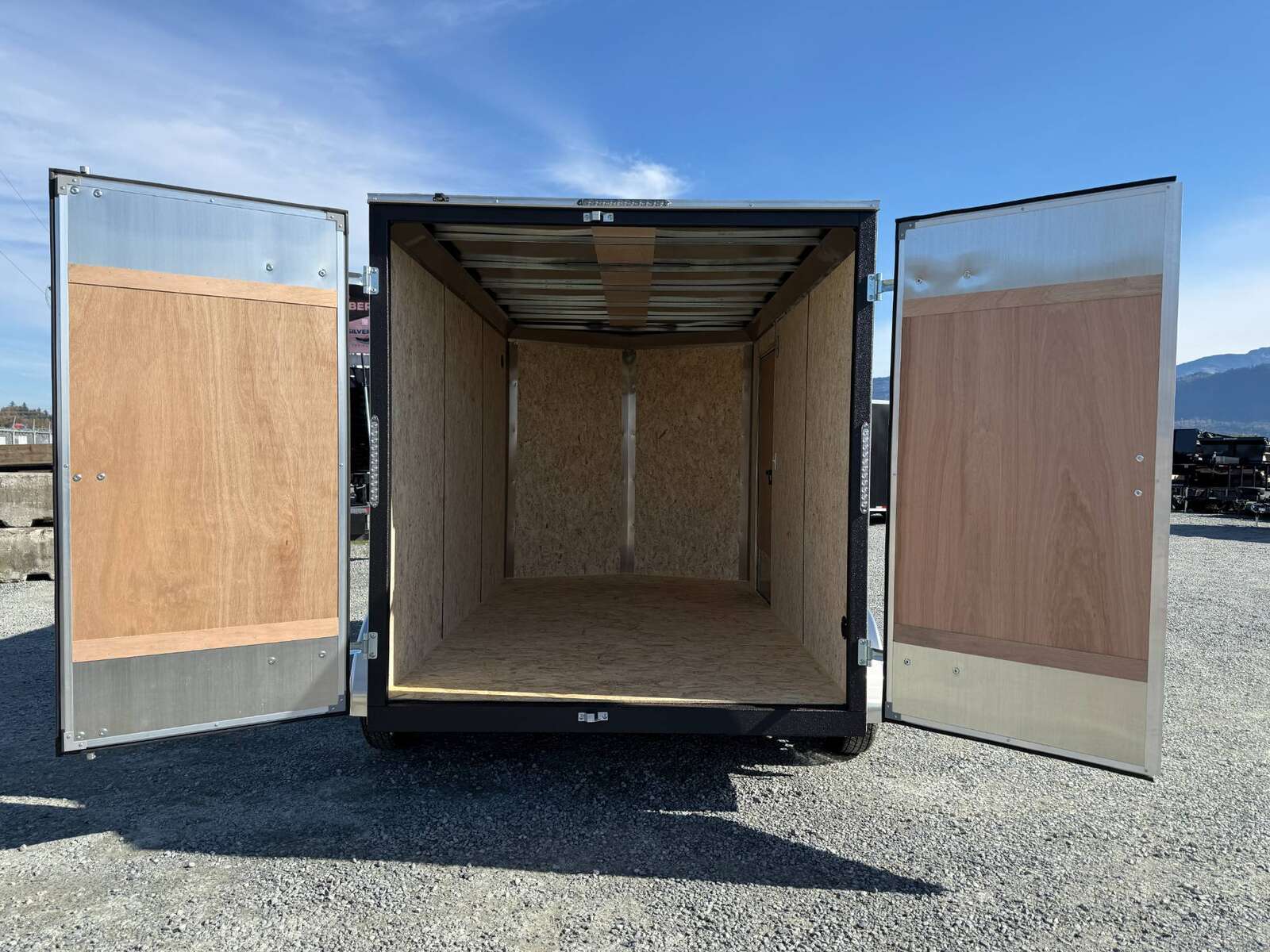 Photo of 2025 Mirage Trailers XE 7x12 V Nose Cargo / Enclosed Trailer Tandem Axle Extra Height Rear Barn Doors White 7000lb GVW