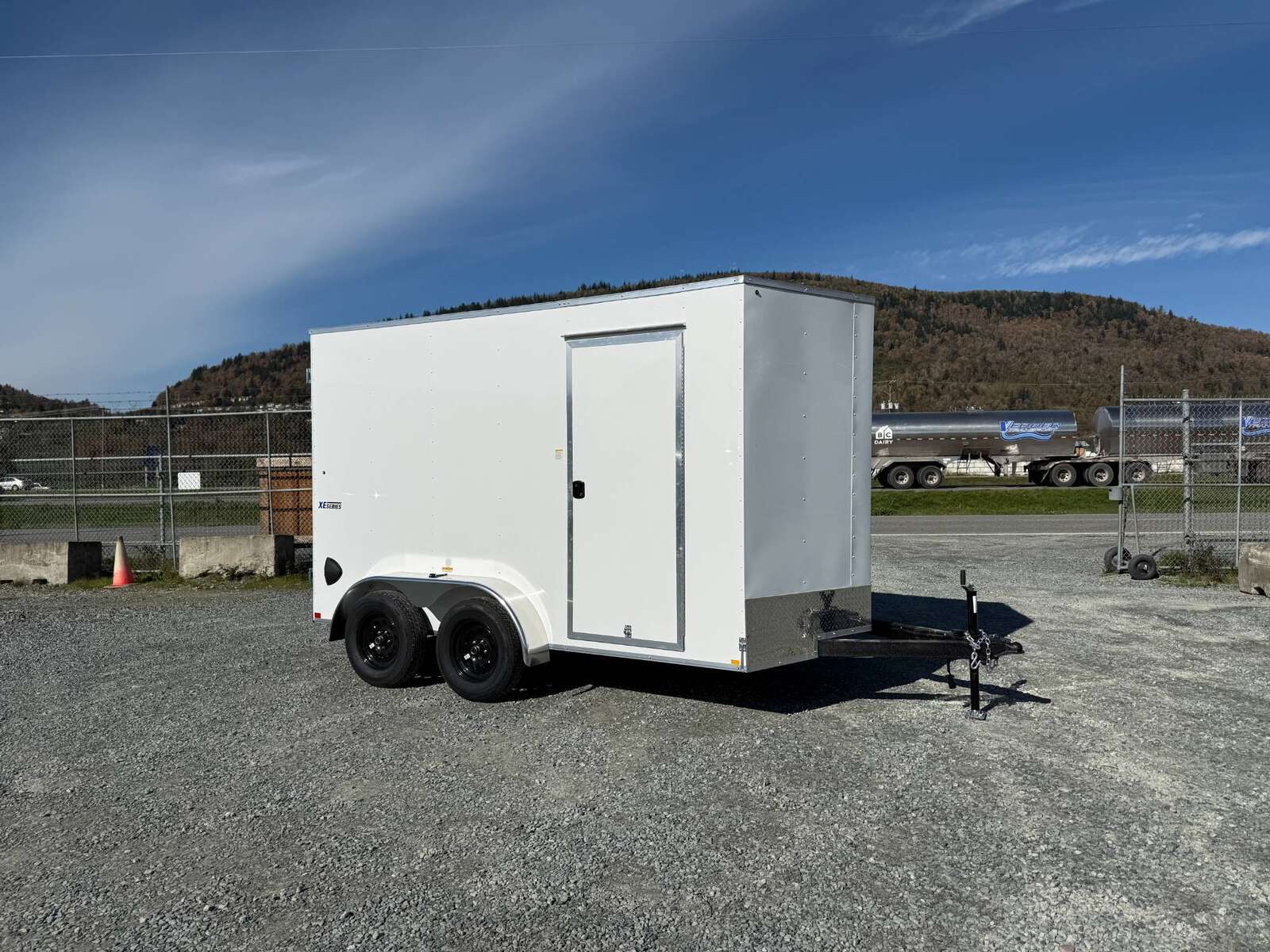Photo of 2025 Mirage Trailers XE 7x12 V Nose Cargo / Enclosed Trailer Tandem Axle Extra Height Rear Barn Doors White 7000lb GVW