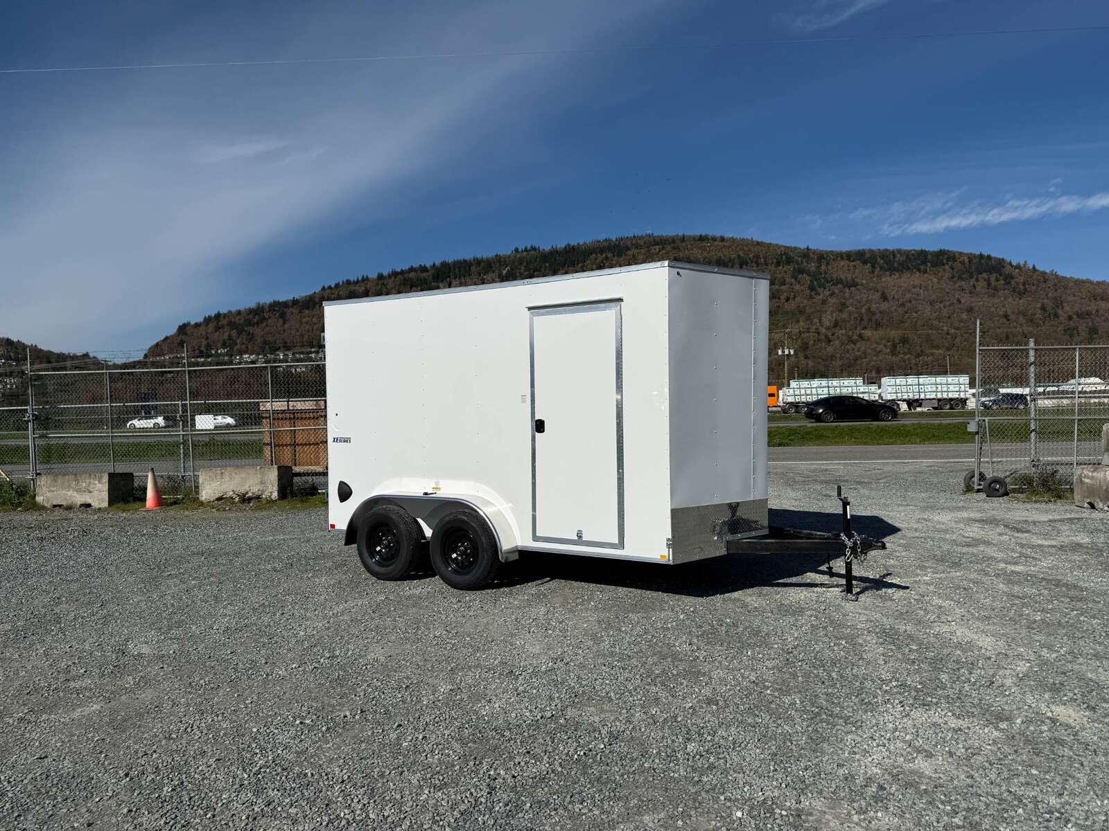 Photo of 2025 Mirage Trailers XE 7x12 V Nose Cargo / Enclosed Trailer Tandem Axle Extra Height Rear Barn Doors White 7000lb GVW