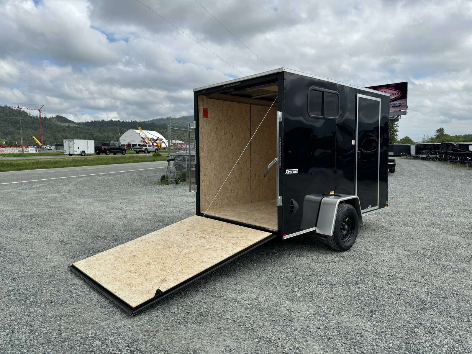 Photo of 2025 Mirage XE 6X10 CAMPING PACKAGE Cargo / Enclosed Trailer SIDE WINDOW BLACK RAMP DOOR EXTRA HEIGHT