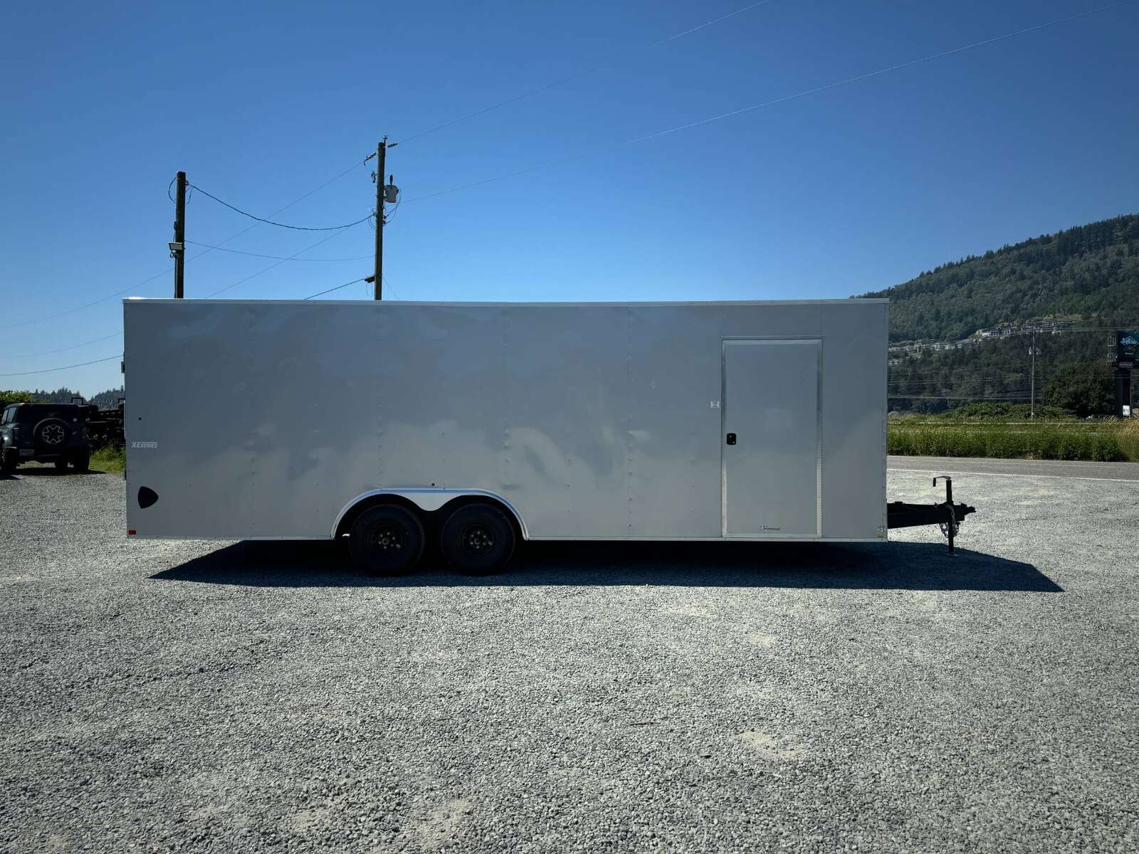 Photo of 2025 Mirage XE 8.5x24 V Nose Cargo / Enclosed Trailer Extra Height Ramp Door Silver 9900lb GVW