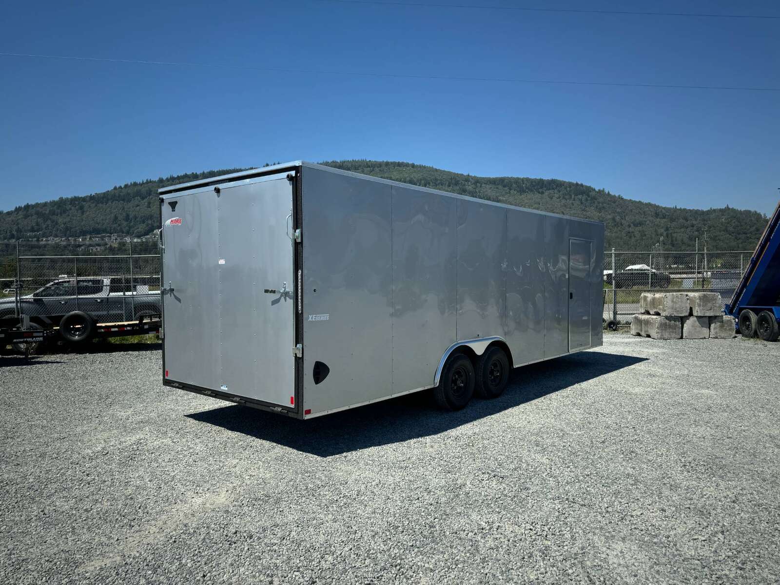 Photo of 2025 Mirage XE 8.5x24 V Nose Cargo / Enclosed Trailer Extra Height Ramp Door Silver 9900lb GVW