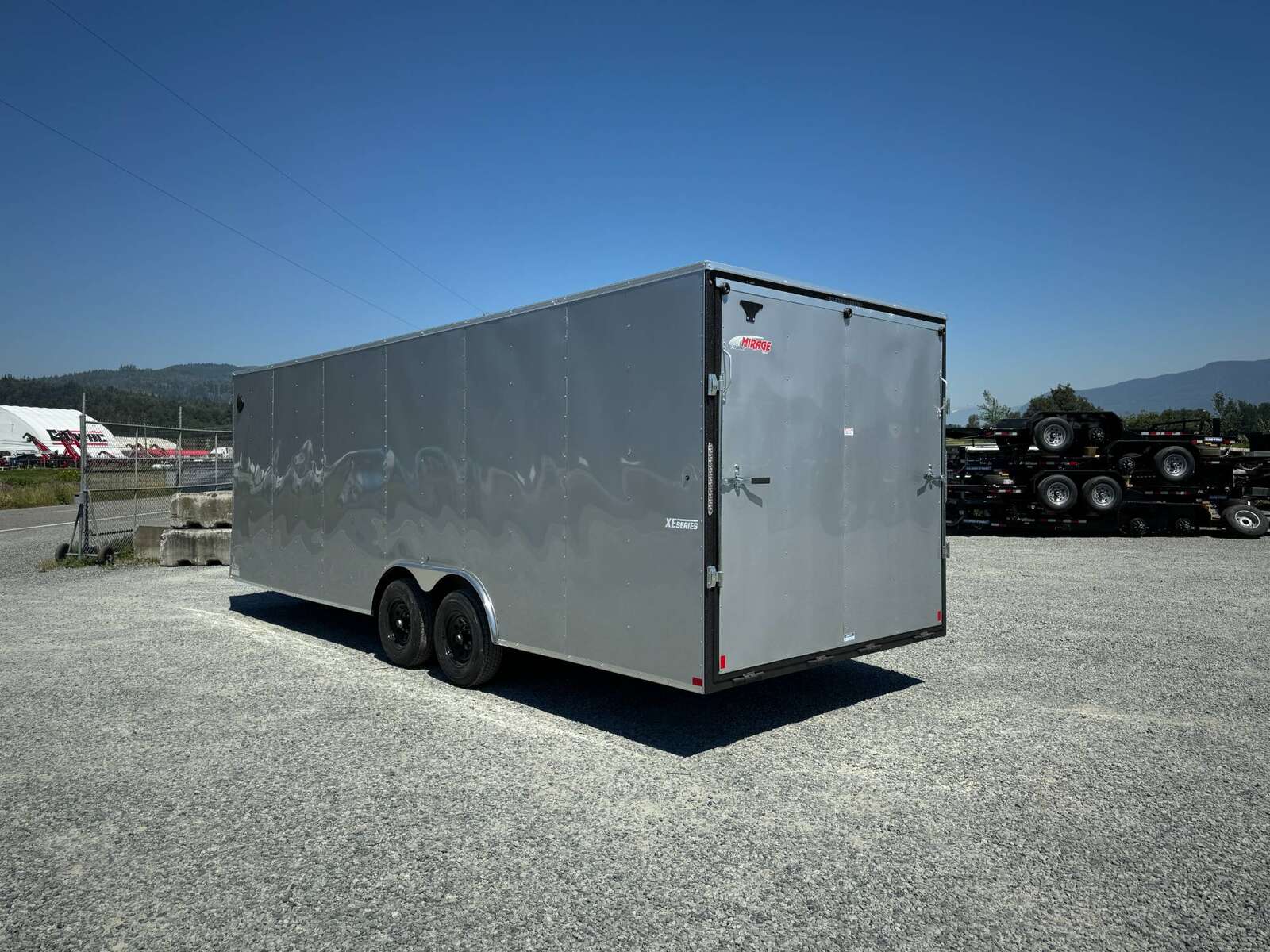 Photo of 2025 Mirage XE 8.5x24 V Nose Cargo / Enclosed Trailer Extra Height Ramp Door Silver 9900lb GVW