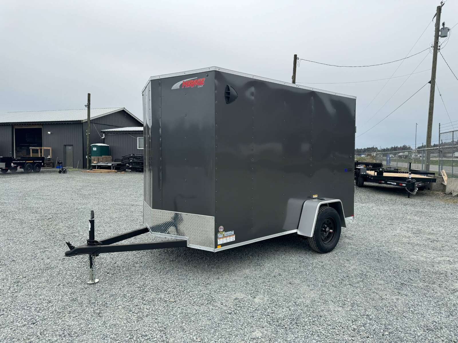 Photo of 2025 Mirage XE 6x10 V Nose Enclosed Cargo Trailer Ramp Door Charcoal Grey Extra Height 2990lb GVW