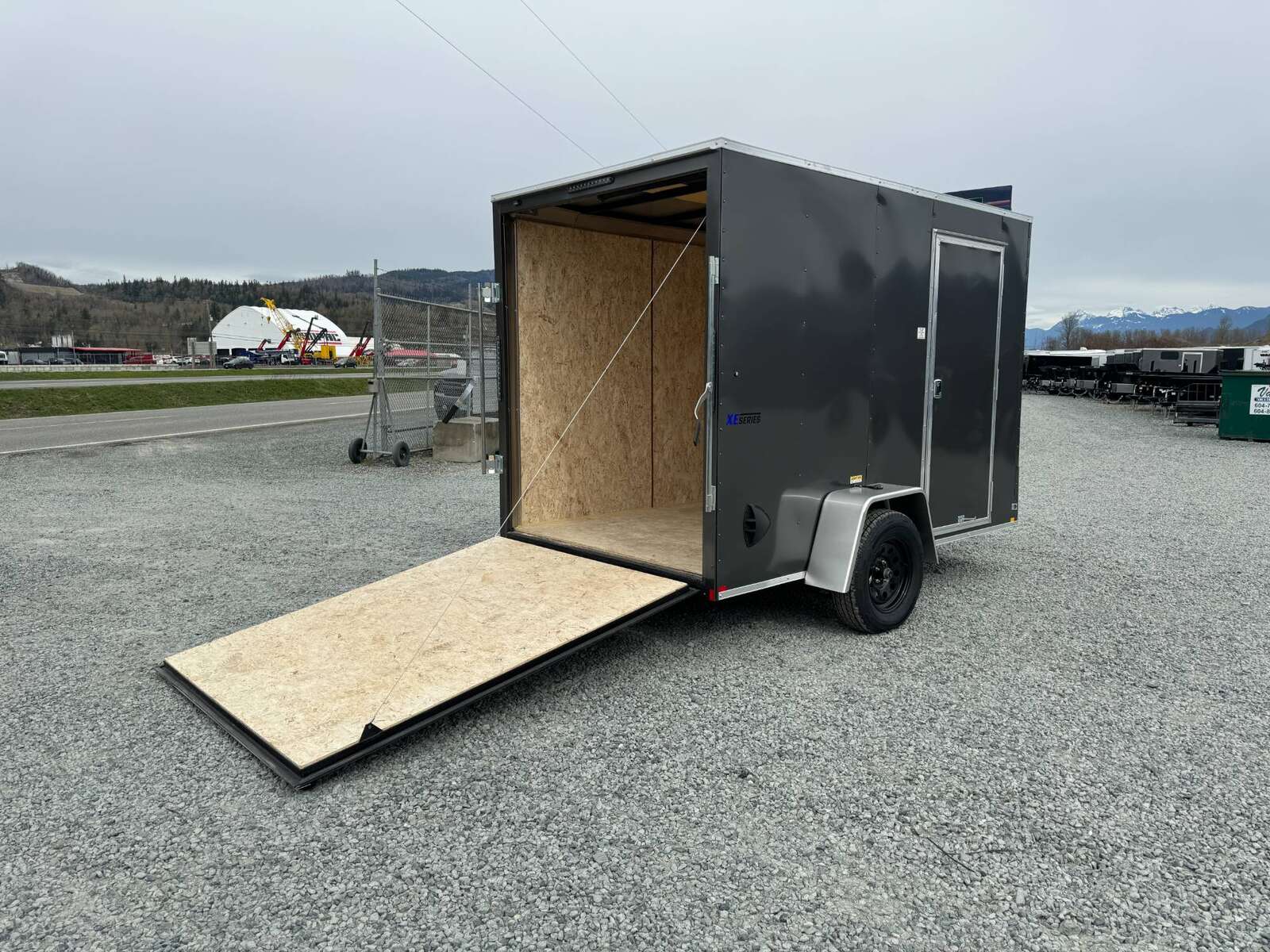 Photo of 2025 Mirage XE 6x10 V Nose Enclosed Cargo Trailer Ramp Door Charcoal Grey Extra Height 2990lb GVW