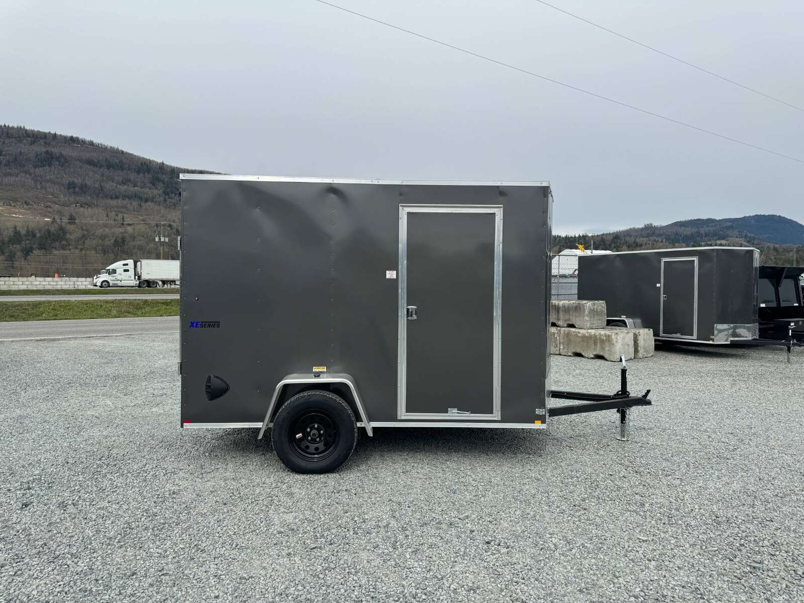 Photo of 2025 Mirage XE 6x10 V Nose Enclosed Cargo Trailer Ramp Door Charcoal Grey Extra Height 2990lb GVW