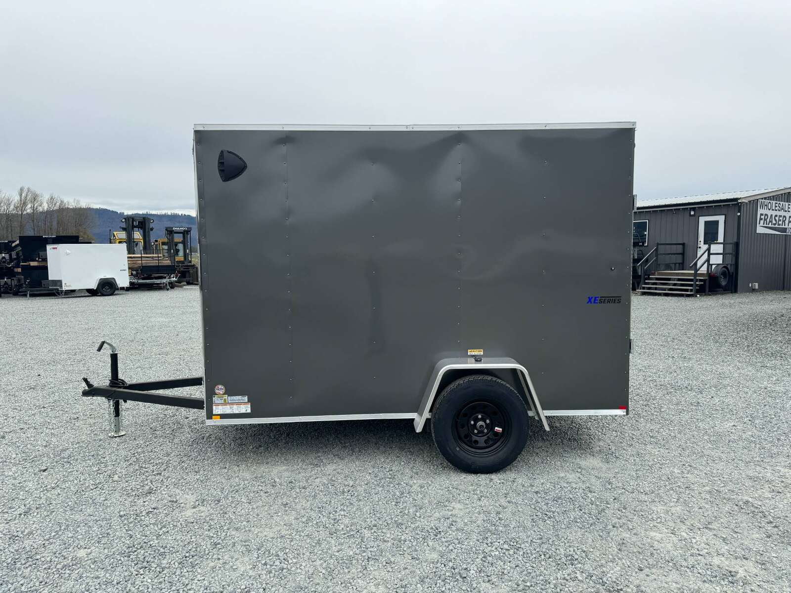 Photo of 2025 Mirage XE 6x10 V Nose Enclosed Cargo Trailer Ramp Door Charcoal Grey Extra Height 2990lb GVW