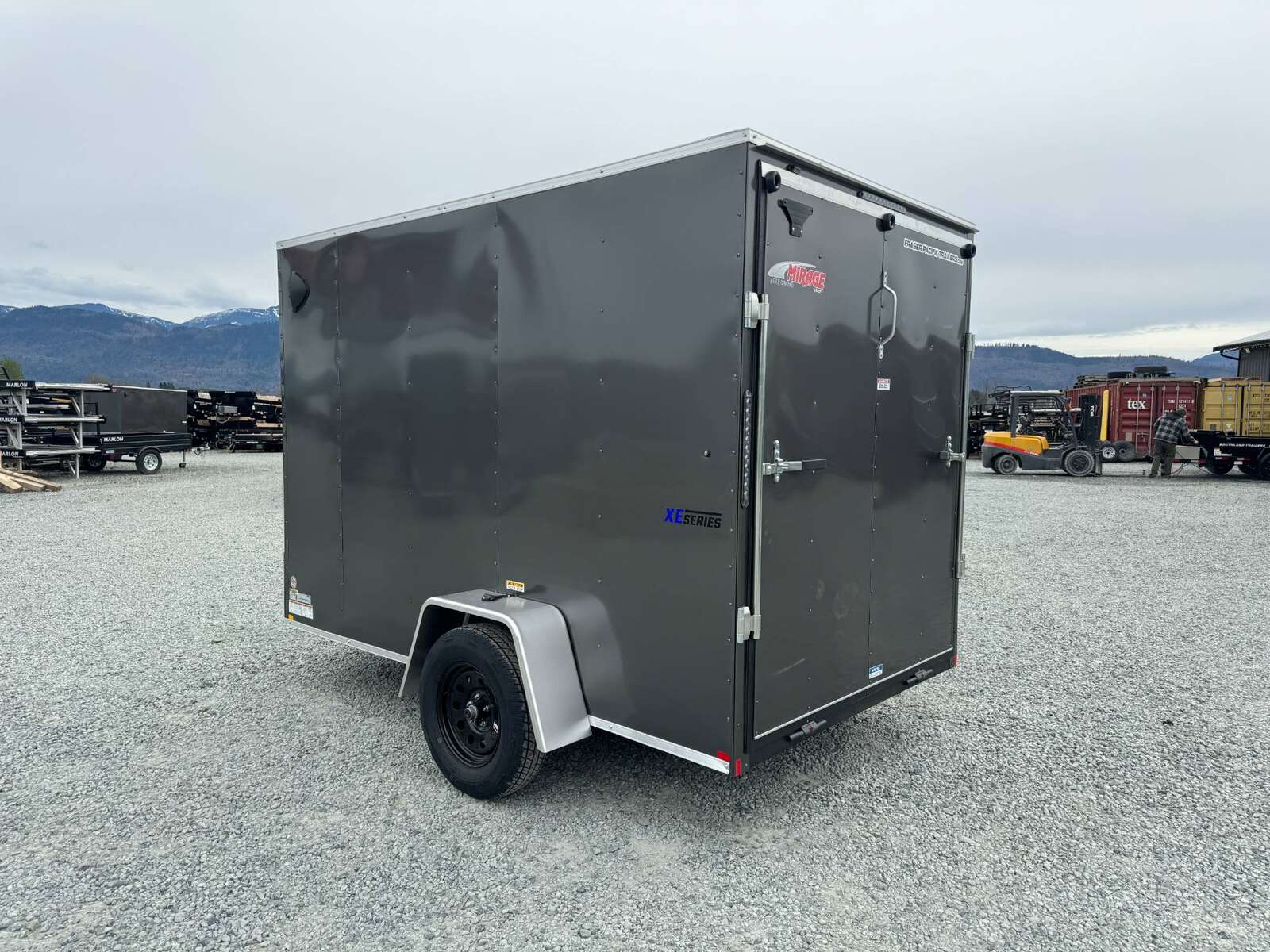 Photo of 2025 Mirage XE 6x10 V Nose Enclosed Cargo Trailer Ramp Door Charcoal Grey Extra Height 2990lb GVW