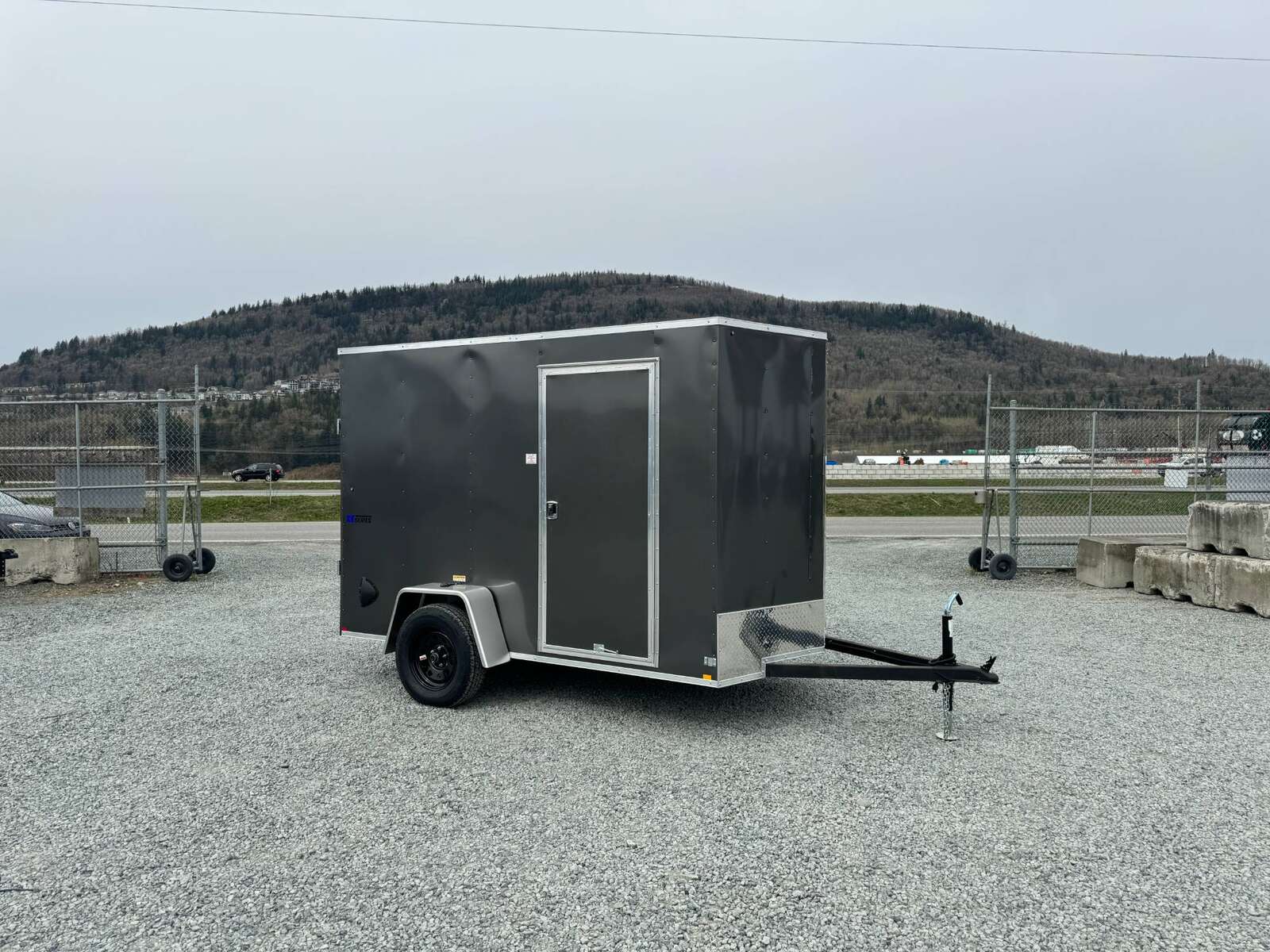 Photo of 2025 Mirage XE 6x10 V Nose Enclosed Cargo Trailer Ramp Door Charcoal Grey Extra Height 2990lb GVW