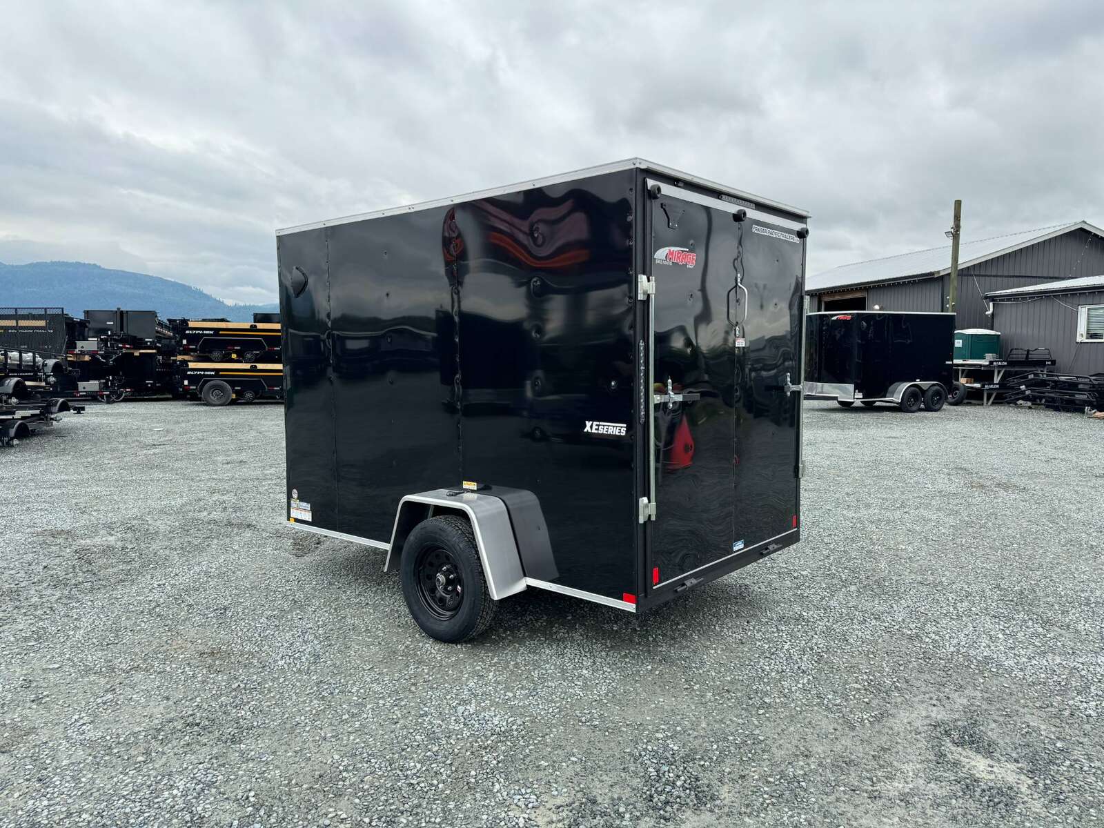 Photo of 2025 Mirage XE 6x10 V Nose Enclosed Cargo Trailer Ramp Door Black Extra Height 2990lb GVW