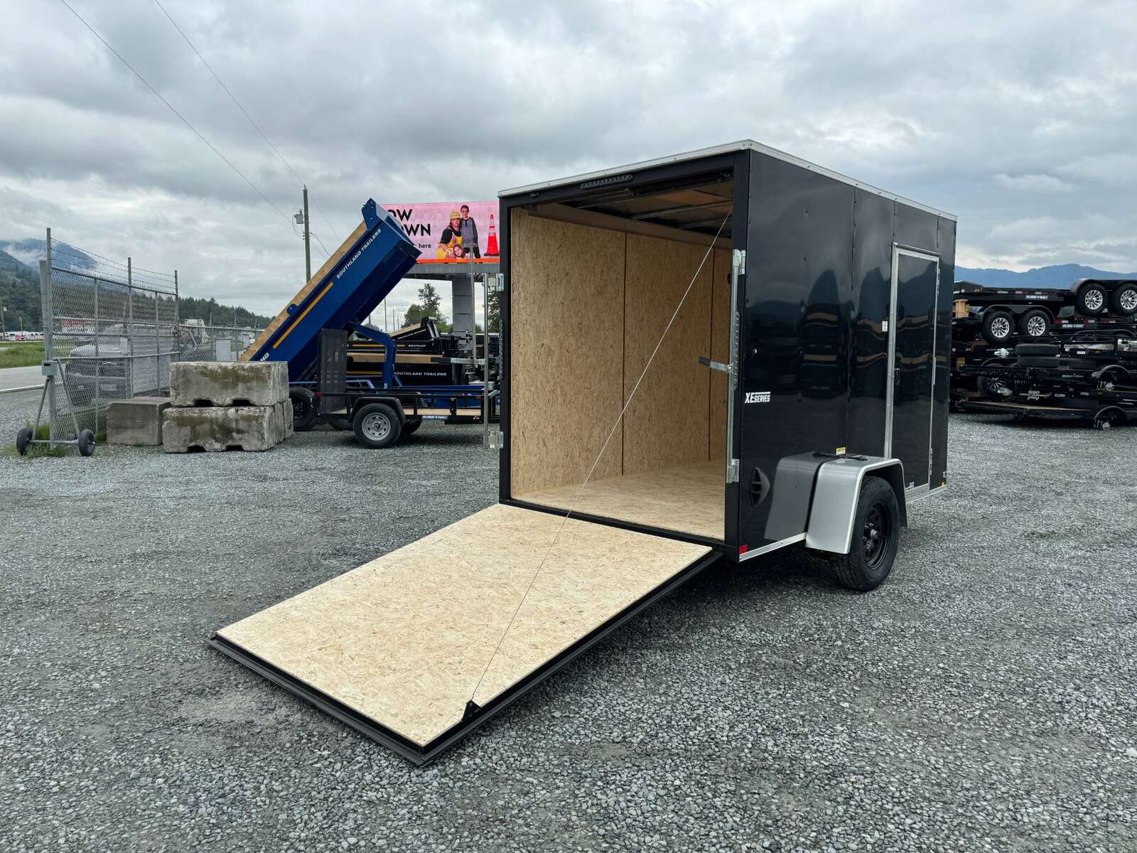 Photo of 2025 Mirage XE 6x10 V Nose Enclosed Cargo Trailer Ramp Door Black Extra Height 2990lb GVW