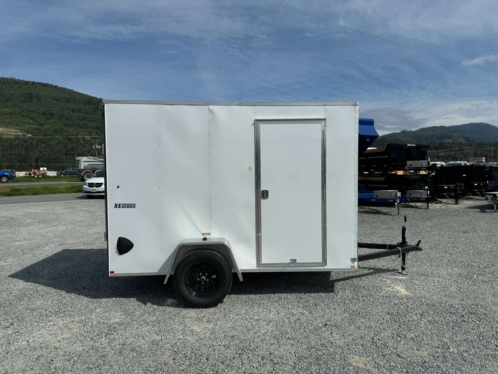 Photo of 2025 Mirage XE 6x10 V Nose Enclosed Cargo Trailer Ramp Door White Extra Height 2990lb GVW