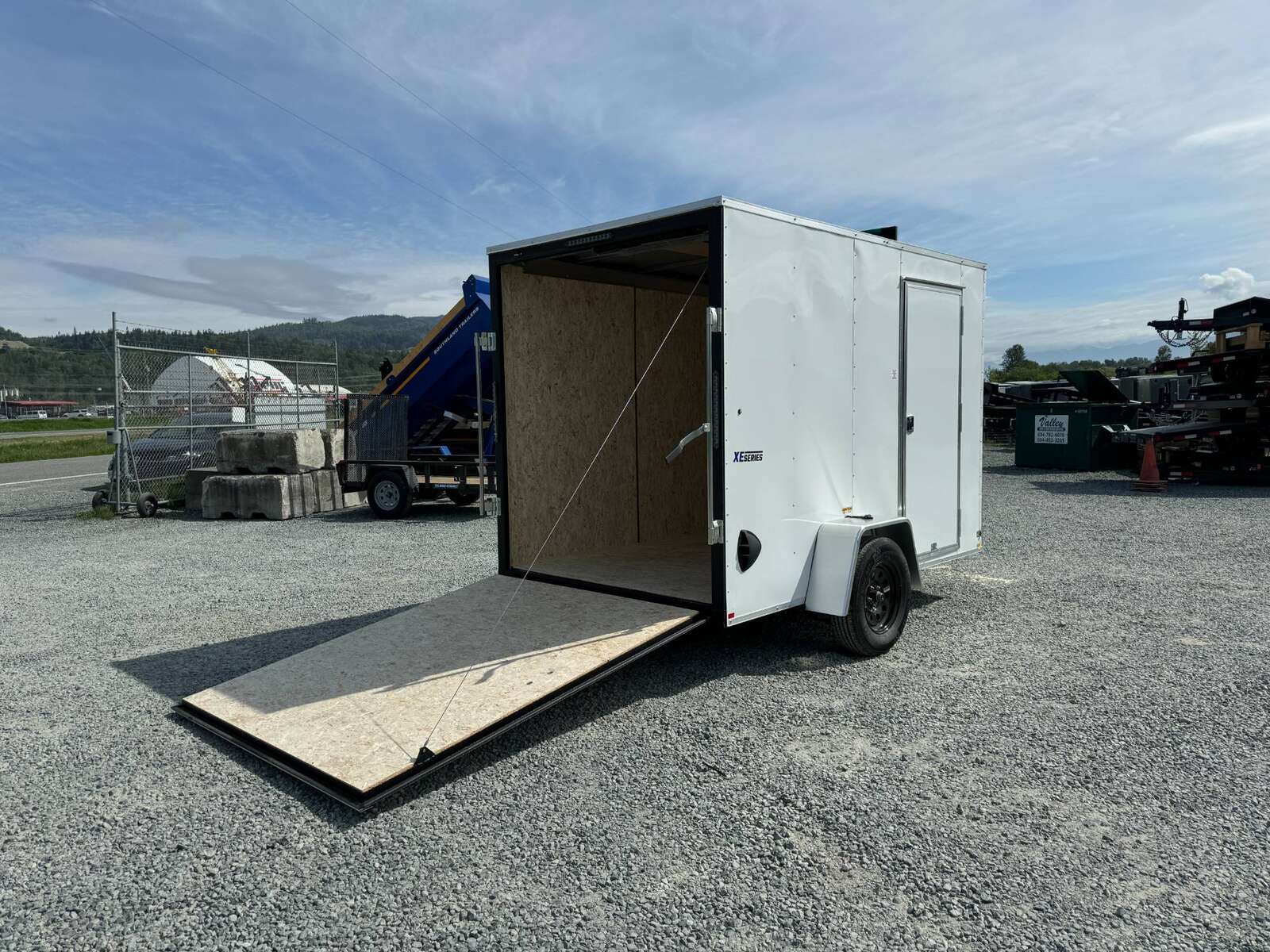 Photo of 2025 Mirage XE 6x10 V Nose Enclosed Cargo Trailer Ramp Door White Extra Height 2990lb GVW