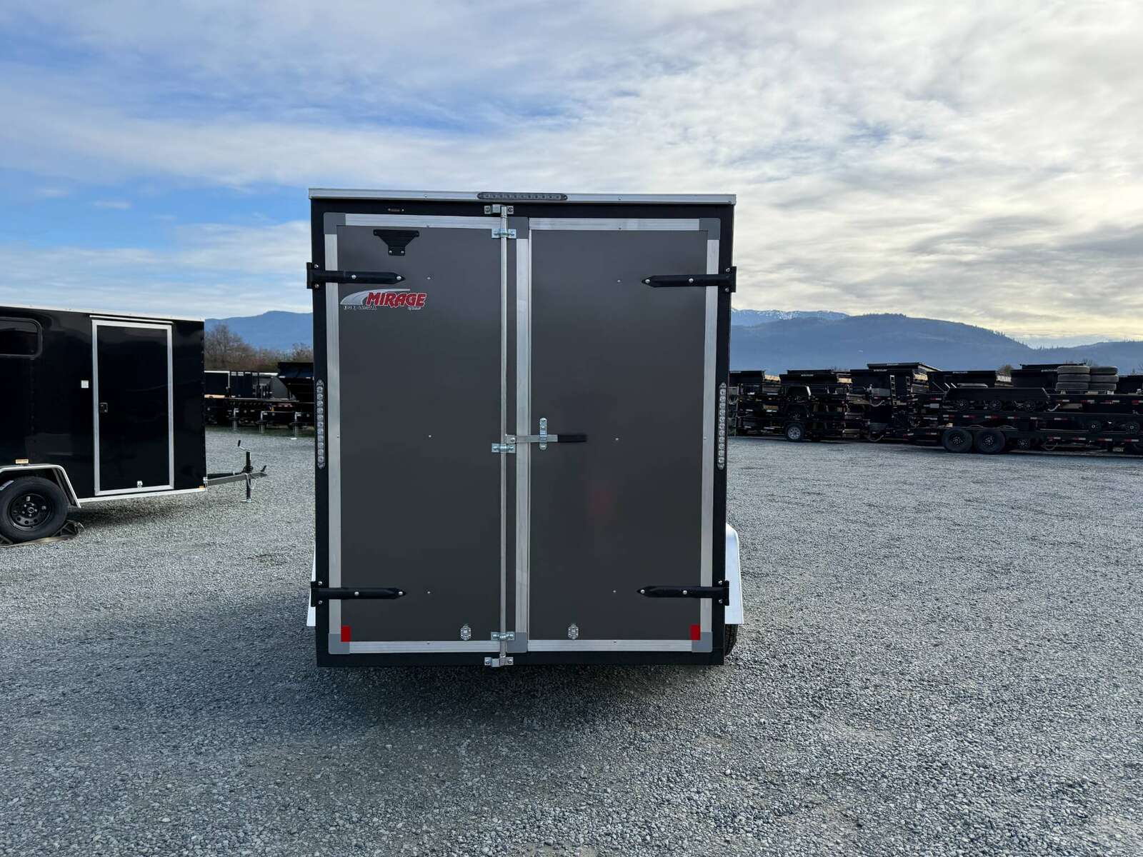 Photo of 2025 Mirage XE 6x10 V Nose Enclosed Cargo Trailer Barn Doors Charcoal Grey Extra Height 2990lb GVW