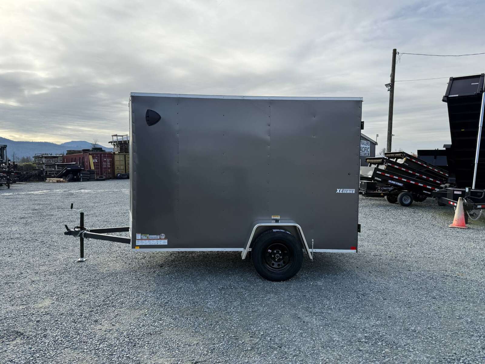 Photo of 2025 Mirage XE 6x10 V Nose Enclosed Cargo Trailer Barn Doors Charcoal Grey Extra Height 2990lb GVW
