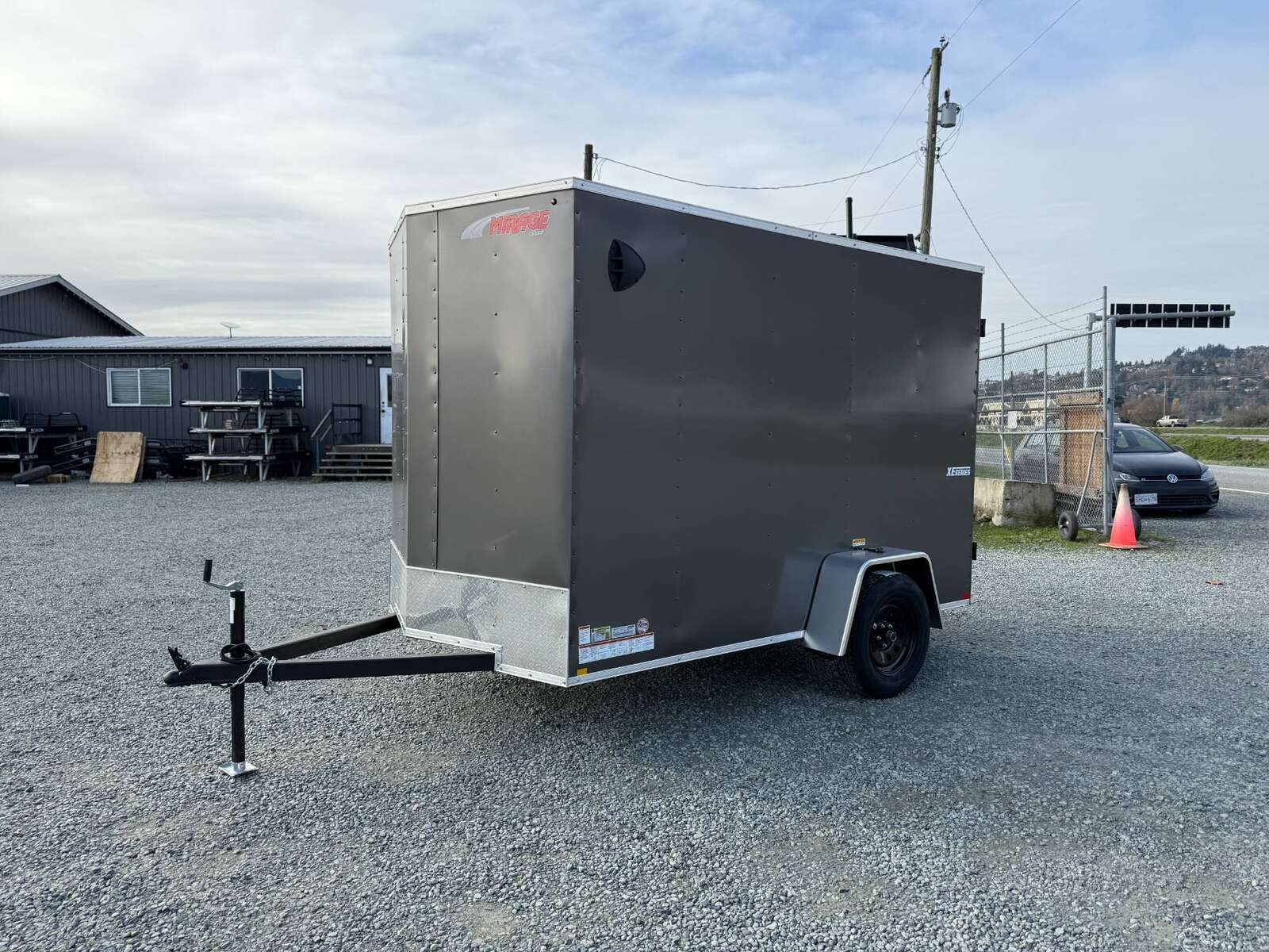 Photo of 2025 Mirage XE 6x10 V Nose Enclosed Cargo Trailer Barn Doors Charcoal Grey Extra Height 2990lb GVW