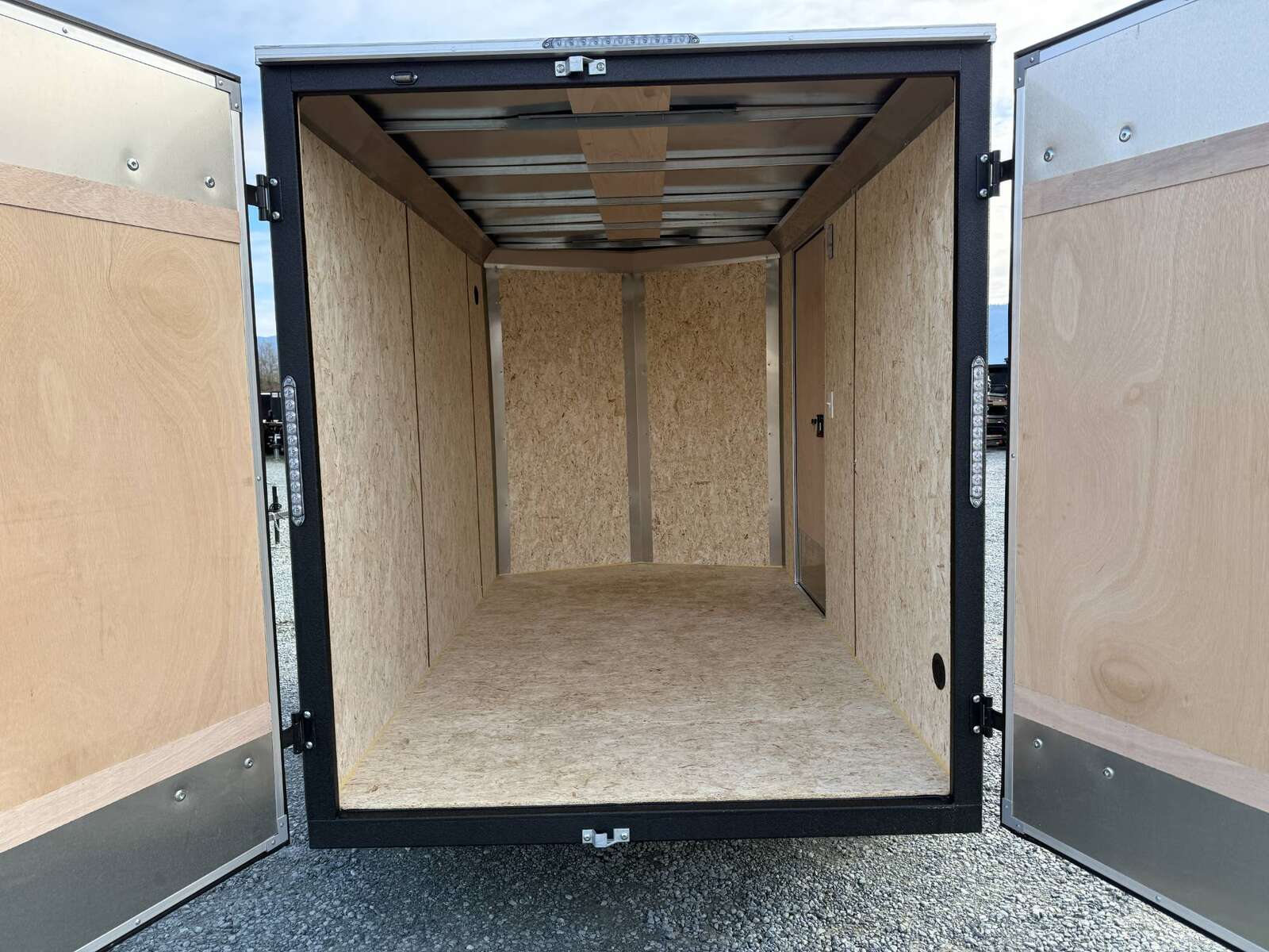 Photo of 2025 Mirage XE 6x10 V Nose Enclosed Cargo Trailer Barn Doors Charcoal Grey Extra Height 2990lb GVW