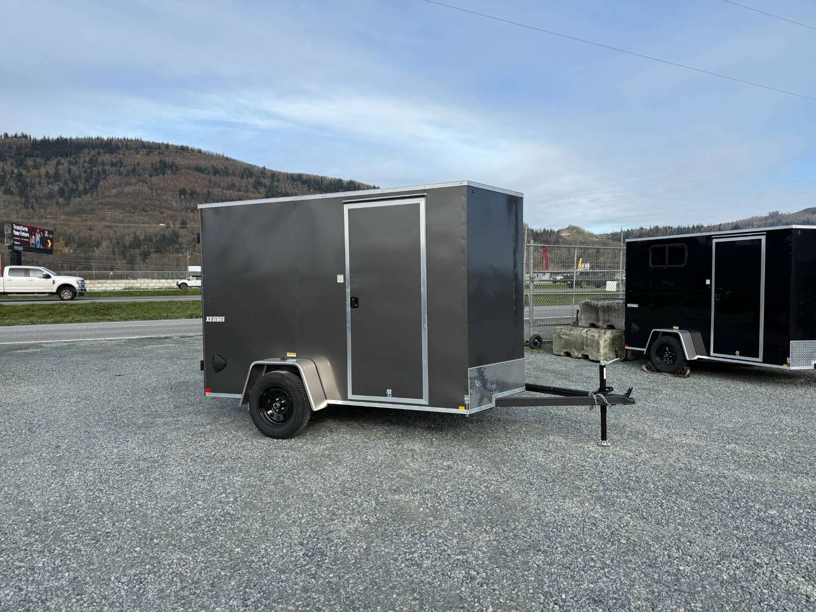 Photo of 2025 Mirage XE 6x10 V Nose Enclosed Cargo Trailer Barn Doors Charcoal Grey Extra Height 2990lb GVW