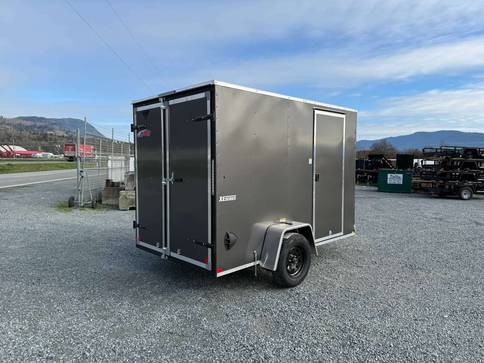 Photo of 2025 Mirage XE 6x10 V Nose Enclosed Cargo Trailer Barn Doors Charcoal Grey Extra Height 2990lb GVW