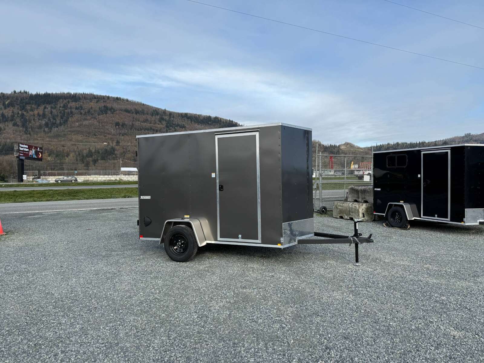 Photo of 2025 Mirage XE 6x10 V Nose Enclosed Cargo Trailer Barn Doors Charcoal Grey Extra Height 2990lb GVW