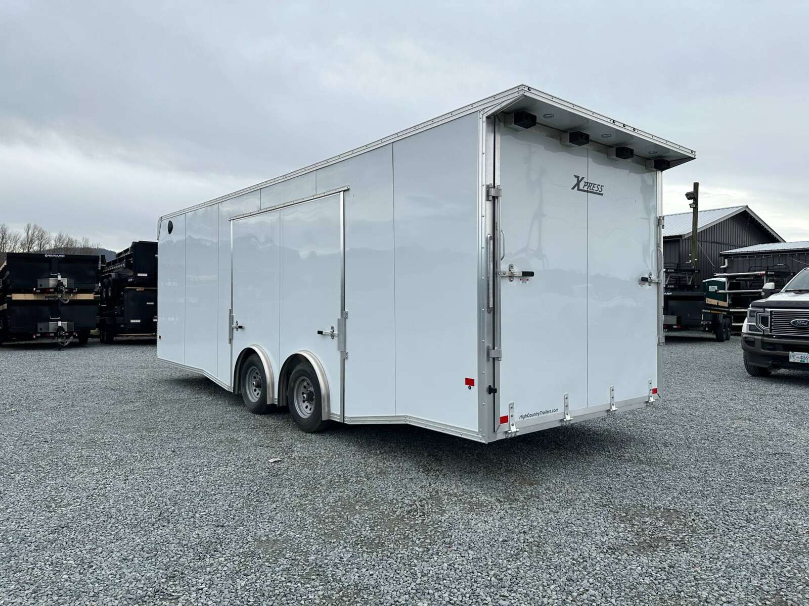 Photo of 2025 ALCOM ALUMINUM 8.5x24 CAR TRAILER 9900lb GVW WHITE LARGE ESCAPE SIDE DOOR