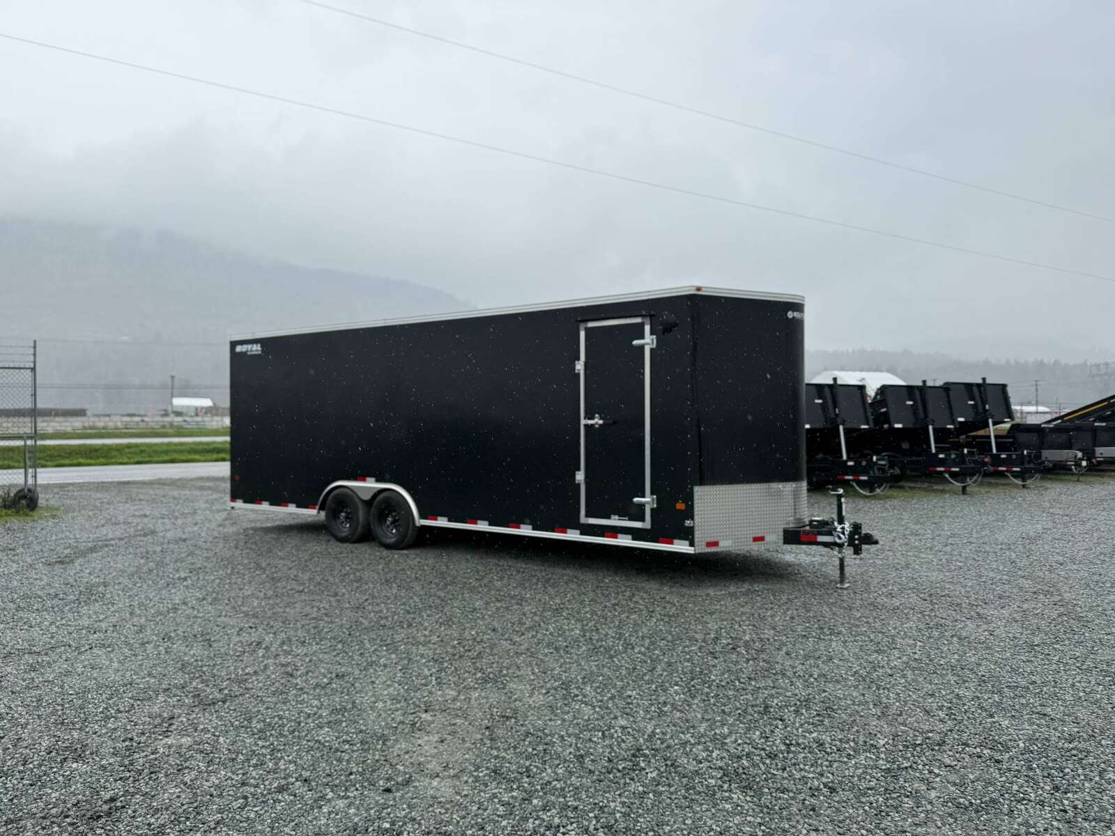 Photo of 2025 Royal Cargo 8.5x24 V Nose Car Hauler Cargo / Enclosed Trailer 11,400lb GVW Black Ramp Door Extra Height