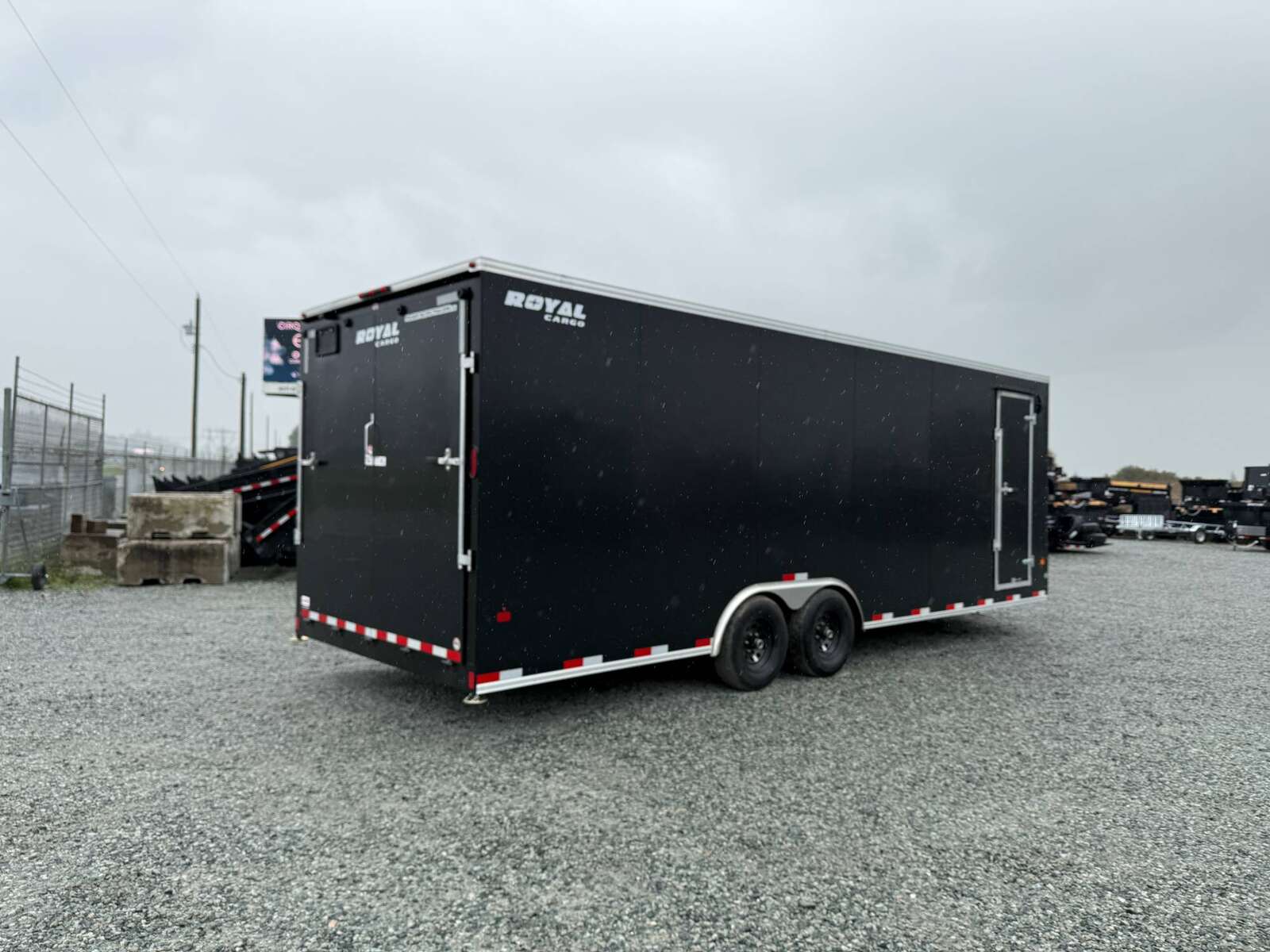 Photo of 2025 Royal Cargo 8.5x24 V Nose Car Hauler Cargo / Enclosed Trailer 11,400lb GVW Black Ramp Door Extra Height