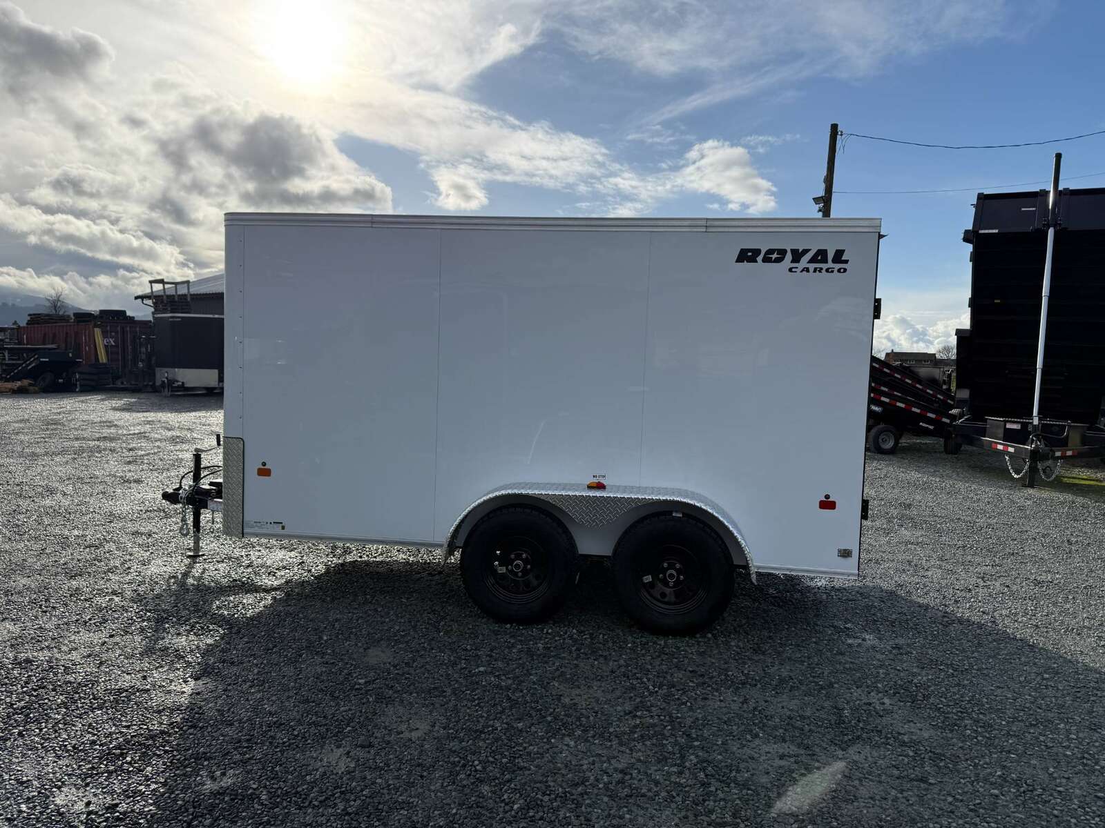 Photo of 2025 Royal Cargo 6x12 Tandem Axle Cargo / Enclosed Trailer Flat Front White Rear Barn Doors 7700lb GVW