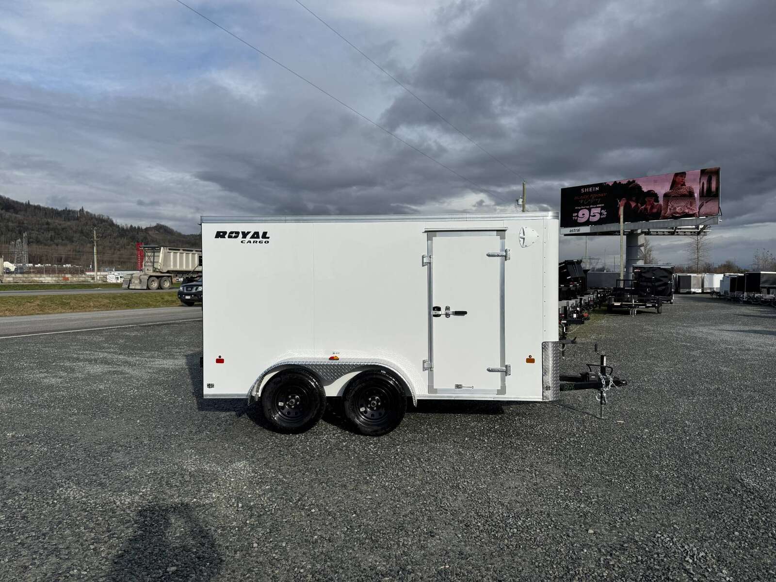 Photo of 2025 Royal Cargo 6x12 Tandem Axle Cargo / Enclosed Trailer Flat Front White Rear Barn Doors 7700lb GVW