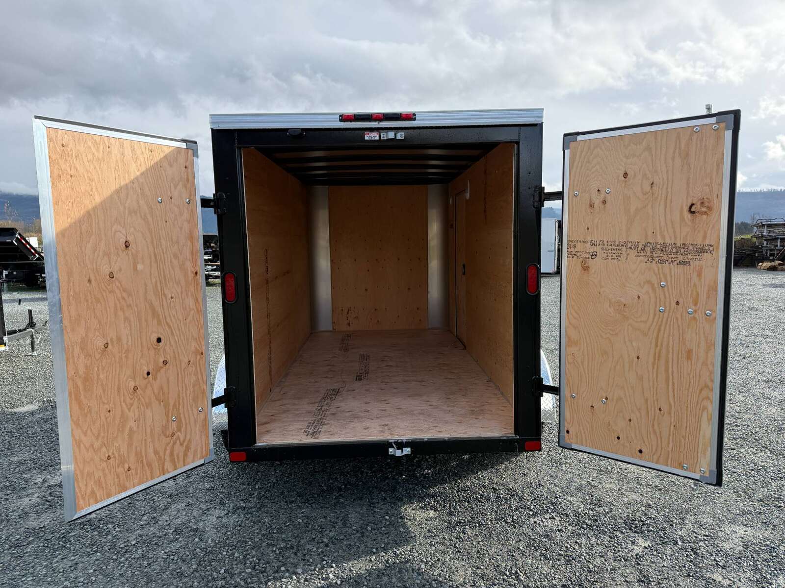 Photo of 2025 Royal Cargo 6x12 Tandem Axle Cargo / Enclosed Trailer Flat Front White Rear Barn Doors 7700lb GVW